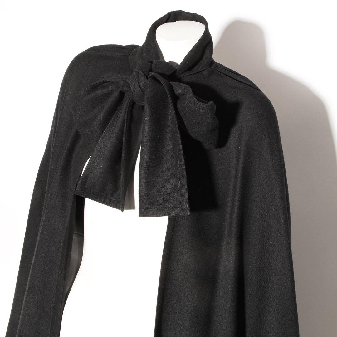 Wool Twill Cape by Karl Lagerfeld for Chloé
Circa 1970's
Black 
Necktie closure
Draped cape no sleeves
No hood
Wool
Made in France
Condition: Excellent condition, little to no visible wear (see photos)
 Size/Measurements: (approximate, taken