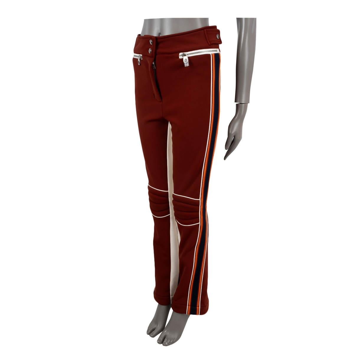 100% authentic Chloé x Fusalp striped 70's style bootcut technical fabric ski pants in burgundy, midnight blue, white and orange stretchy polyamide (45%), polyester (42%) and elastane (13%). Lined in polyester (94%) and elastane (6%). Open with two