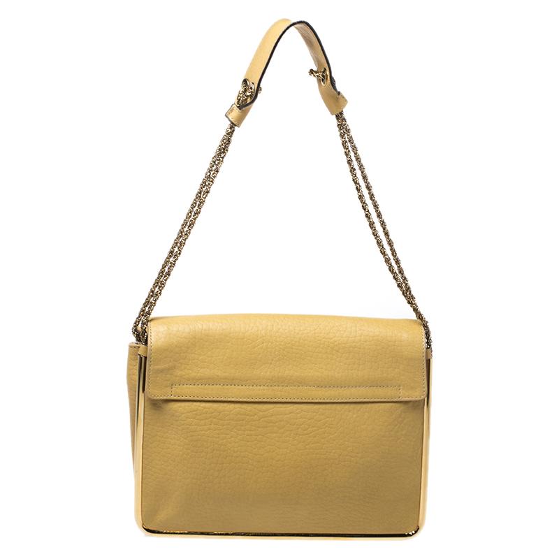 Now here's a bag that is both stylish and functional! Chloe brings us this gorgeous shoulder bag that has been crafted from leather and designed with a flap that opens up to a fabric interior capable of carrying all your essentials. The piece is