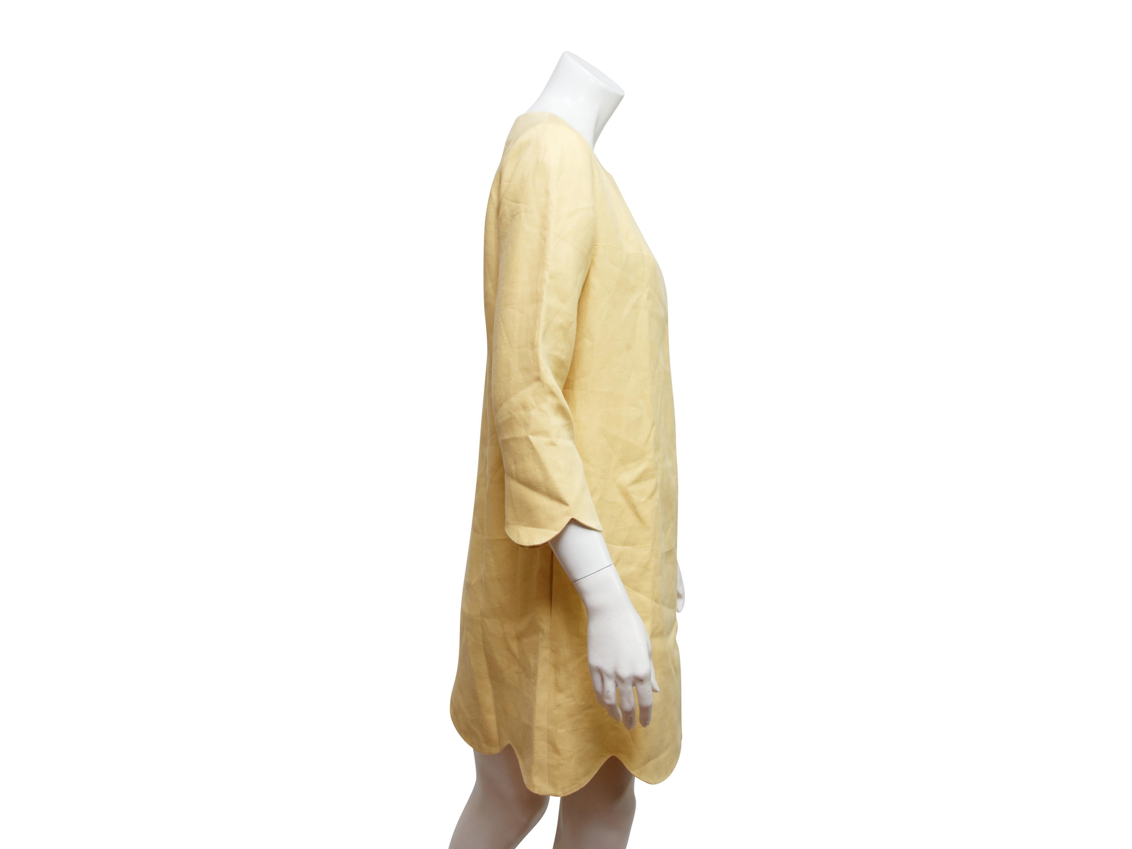 Product details:  Yellow scallop-trimmed shift dress by Chloe.  Roundneck.  Three-quarter length sleeves.  Concealed back zip closure.  Label size FR 40.  38