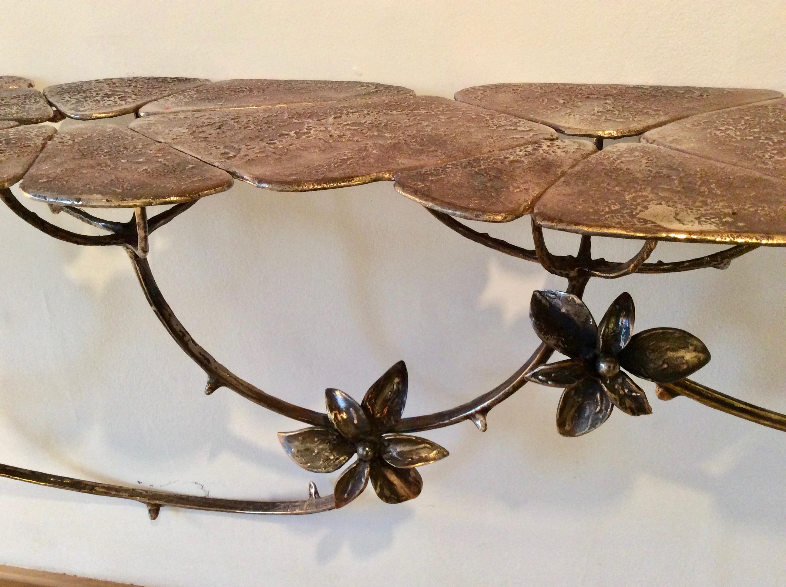 A enchanting, organic wall-mounted console by British artist, Mark Brazier-Jones. Cast in bronze, the top surface formed as 'leaves' whose blossoming tendrils form the support of the console.
Signed and dated 'Mark Brazier-Jones 2019'.