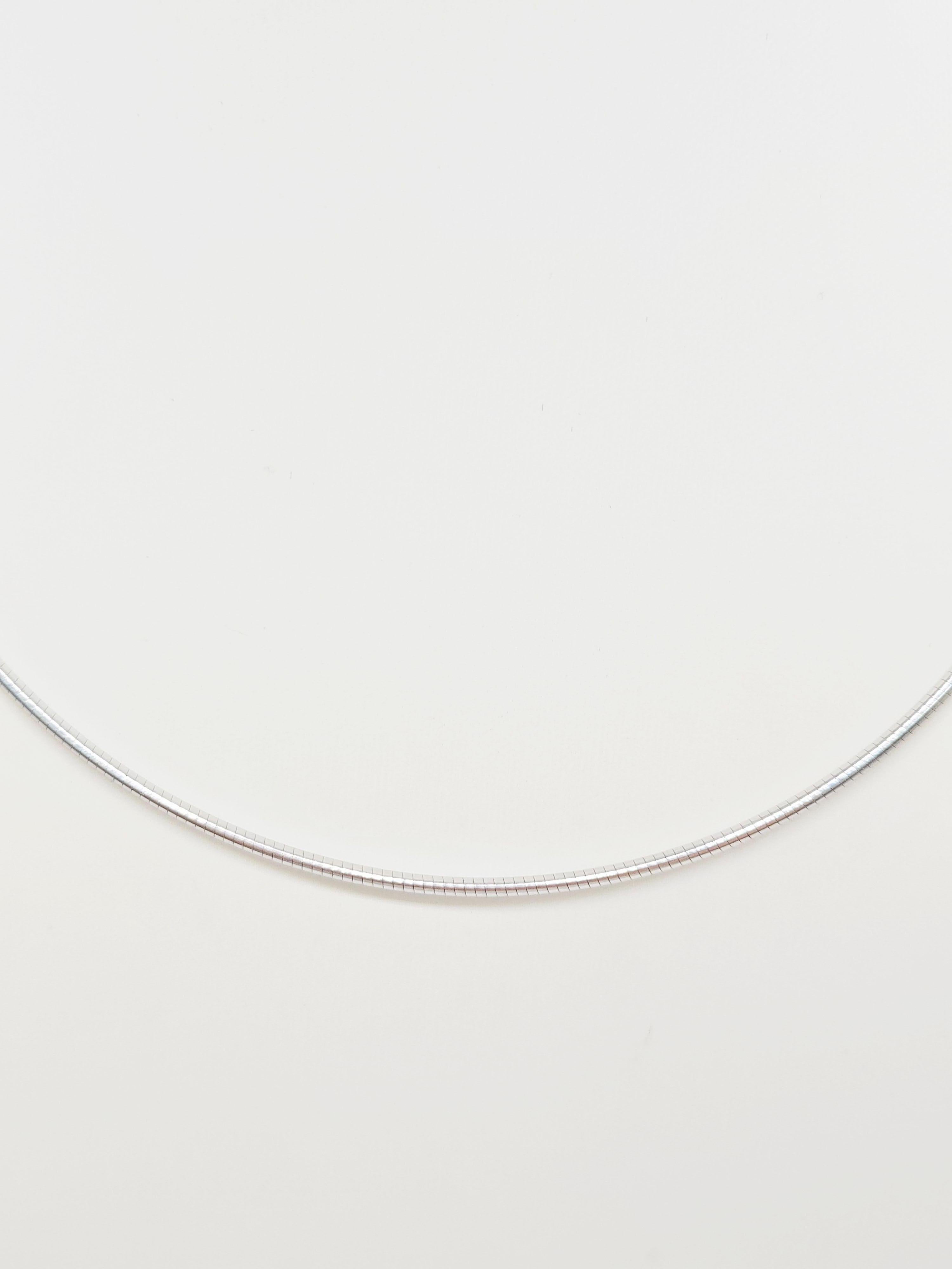 Elegant 14K White Gold Choker Necklace – 16 Inch

A timeless and minimalist essential, this choker is crafted in solid 14 karat white gold, offering a warm and radiant glow. Designed to sit gracefully at the neckline, the 16-inch length makes it