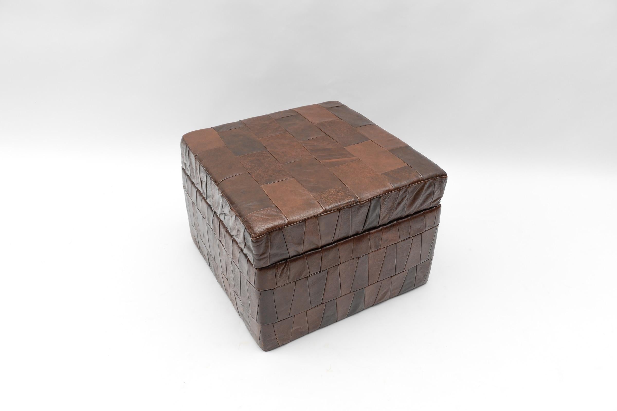 Swiss Choco Brown Leather Patchwork Pouf with Storage Space from De Sede, 1960s For Sale