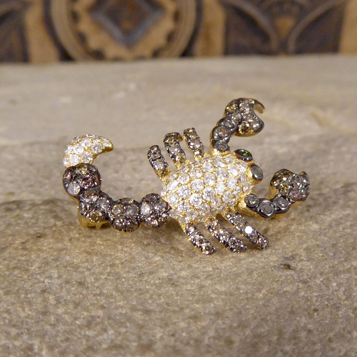 This lovely little Scorpion piece can either be worn as a pendant or a brooch depending on the occasion. It has been fully crafted from 18ct Yellow Gold and is adorned with white Diamonds throughout the body and stinger, with an oxidised tail, legs