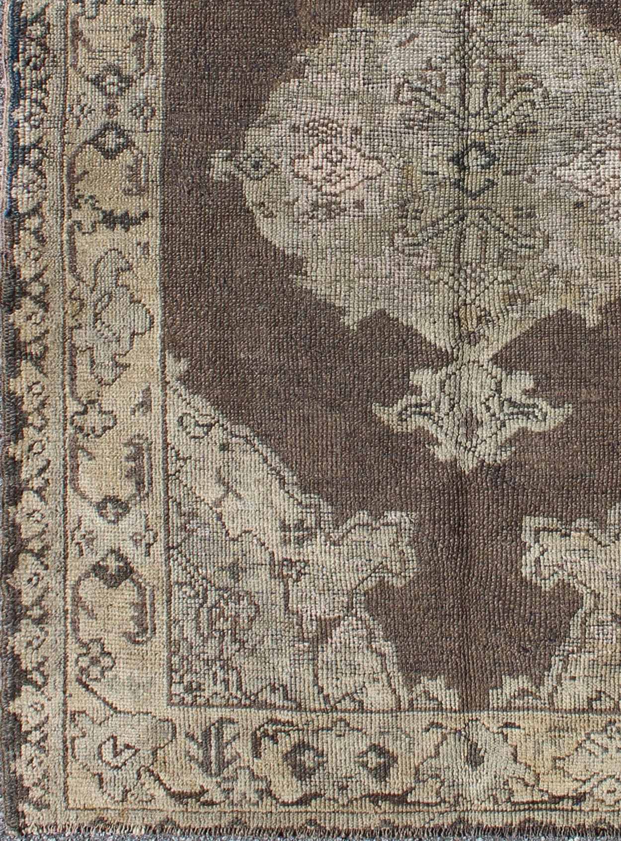 Hand-Knotted Chocolate Background Vintage Turkish Oushak Rug with Floral Medallion in Cream For Sale