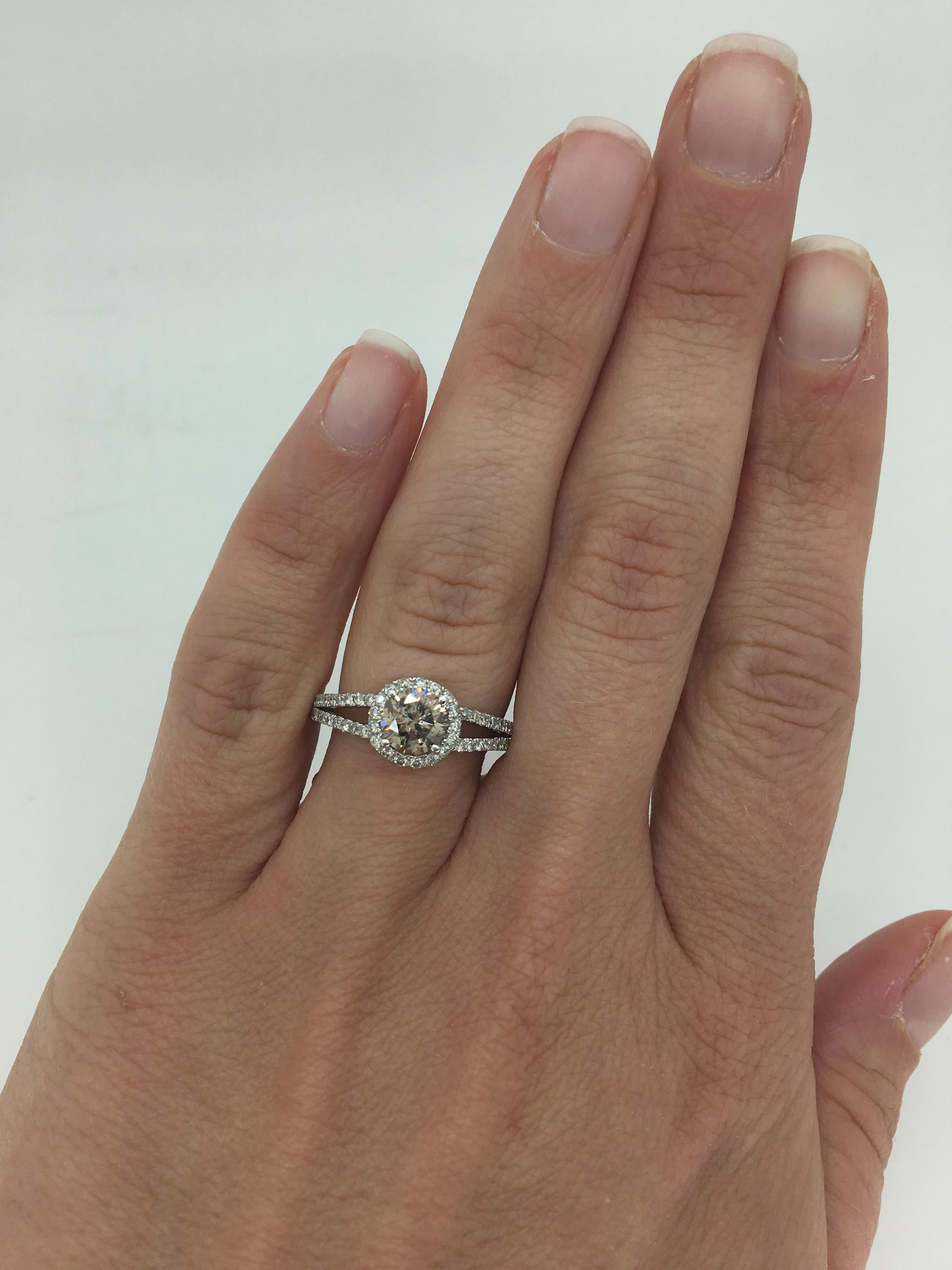 This beautiful ring features a beautiful approximately .90CT Round Brilliant Cut Diamond set in an elegant 14k white gold split shank halo setting.

Center Diamond Carat Weight: Approximately .90CT
Center Diamond Cut: Round Brilliant
Center Diamond