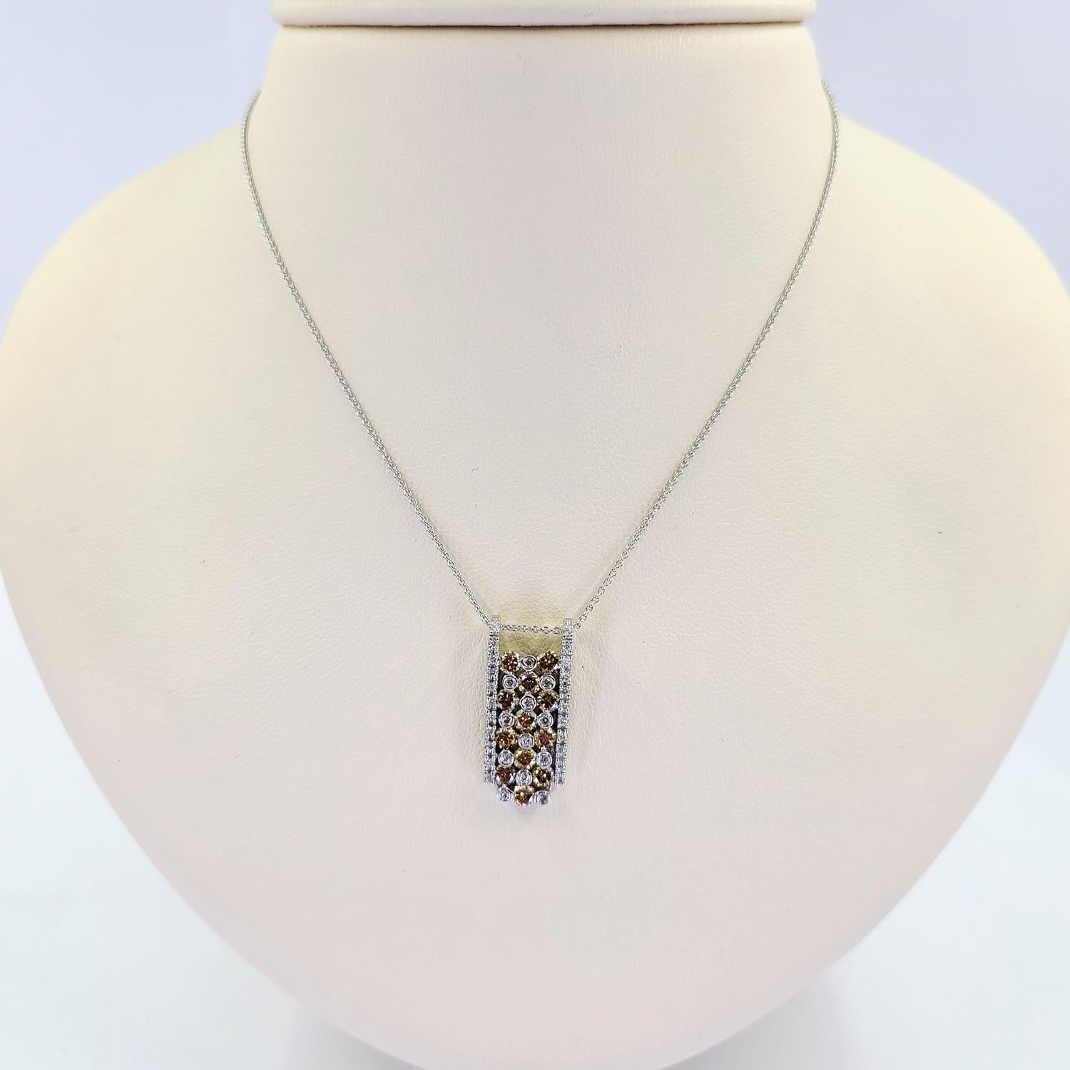 14 Karat White Gold Waterfall Pendant Necklace Featuring 34 Round Brilliant Cut Diamonds of SI Clarity and H/I Color Totaling 0.17 Carats Accented by 12 Round Brilliant Cut Brown Diamonds of VS Clarity Totaling Approximately 1.20 Carats. 16 Inch