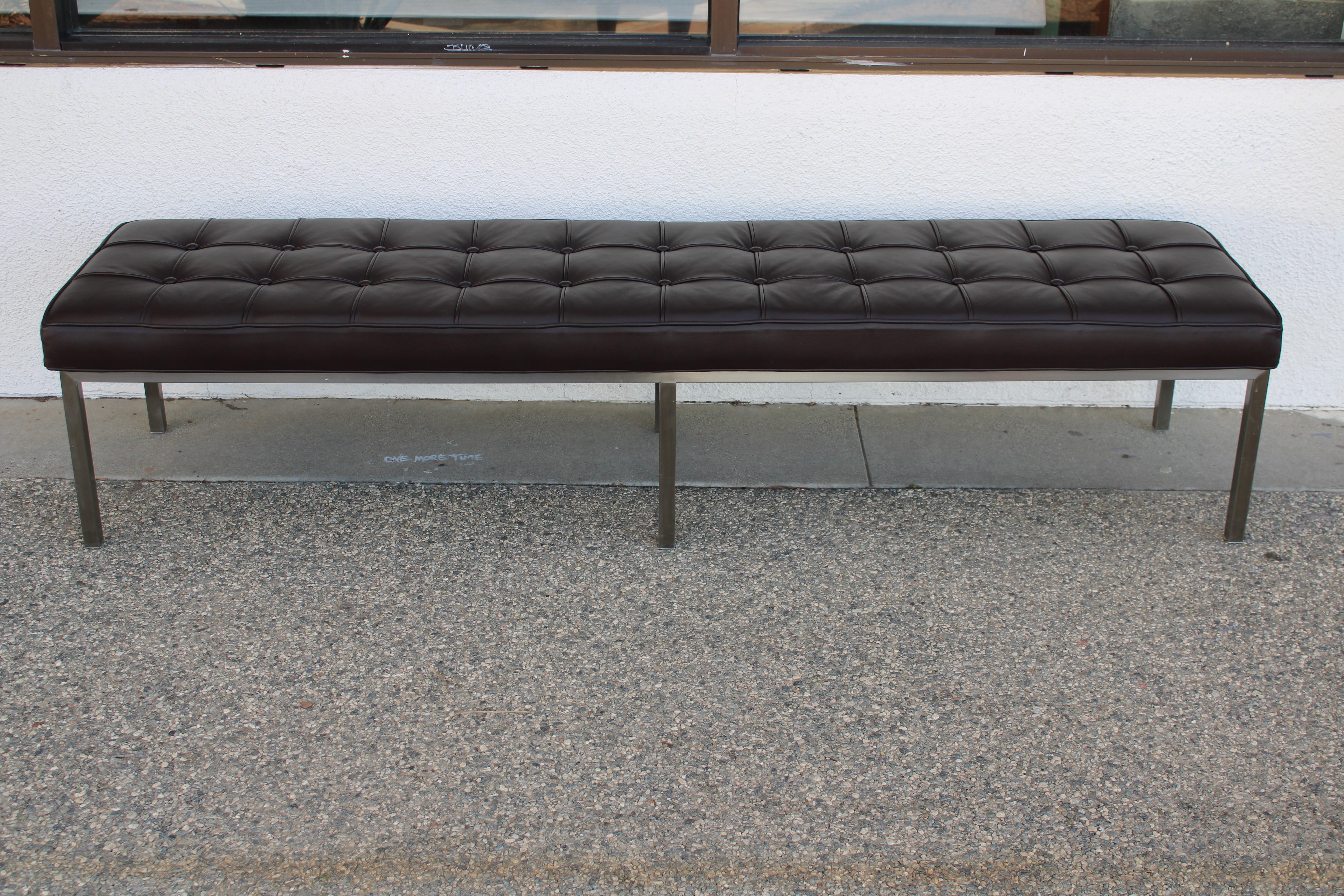 Aluminum with chocolate leather bench by Brueton Industries. Bench measures 72