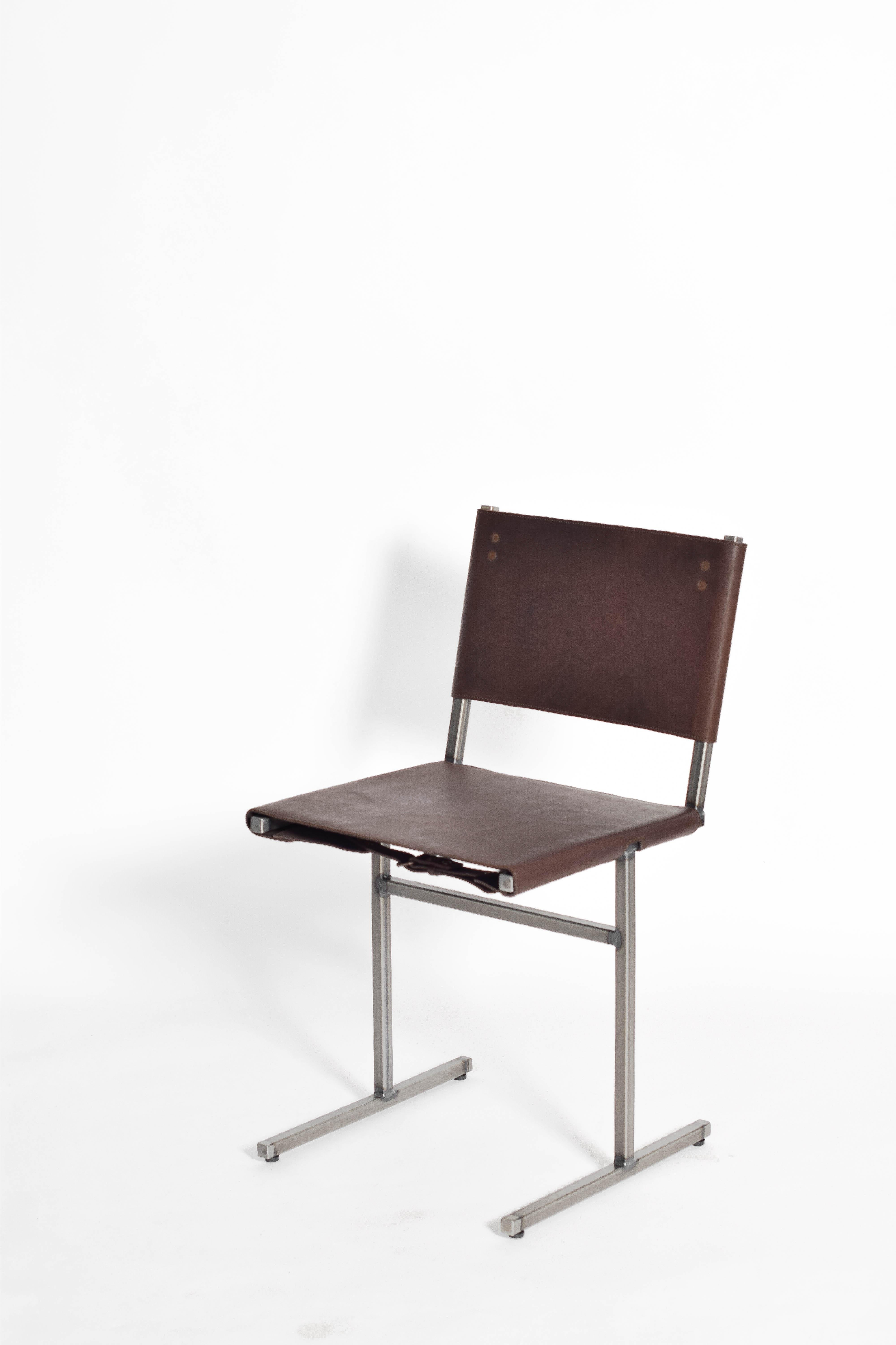 Chocolate Memento chair, Jesse Sanderson
Original signed chair by Jesse Sanderson
Materials: leather, steel
Dimensions: W 43 x D 50 x H 80 cm 
 Seating height: 47 cm

Frame finishes available in brass, bare steel, matt black

Five lines and