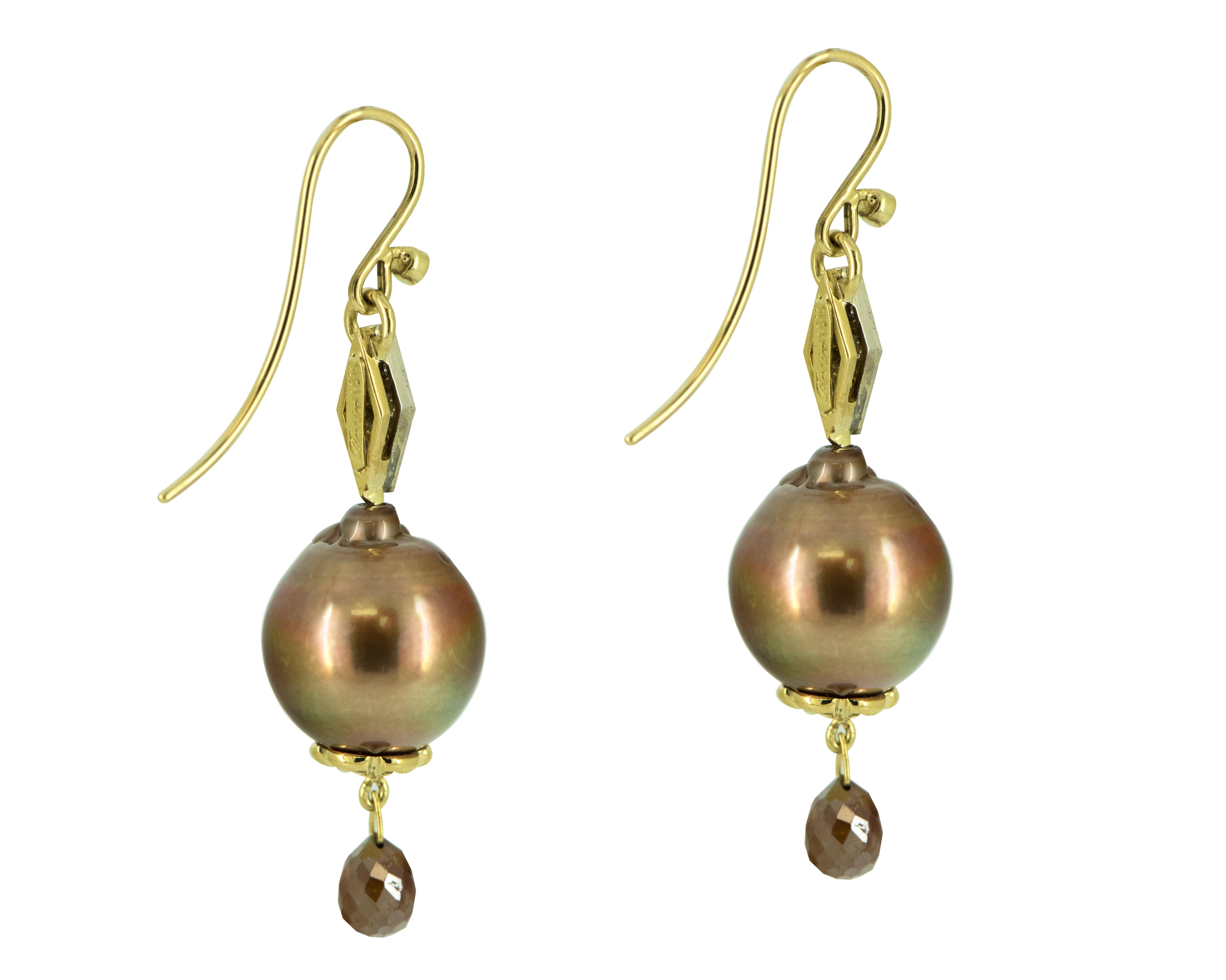 These Truffle Chocolate Cultured Pearl and Diamond Earrings are a timeless piece that is perfect for the modern woman looking to add a touch of elegance to her jewelry collection. The combination of pearls, diamonds, and 18 Karat Yellow Gold creates