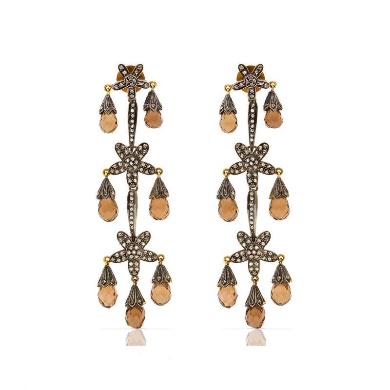 Chocolate Quartz Diamond Chandelier Earrings featuring  luminous chocolate quartz faceted droplets set with diamonds in a design reminiscent of the iconic Art Deco period. When worn, the marriage of the quartz droplets and diamonds moving and