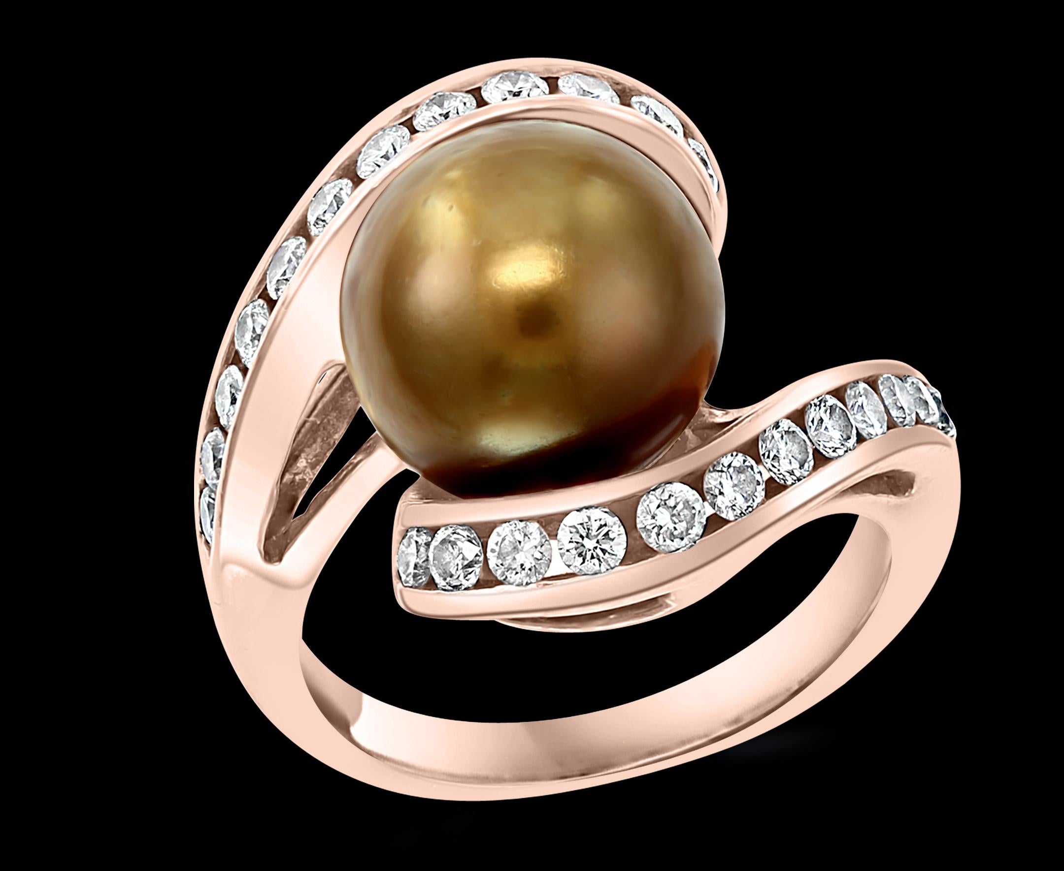 10 mm  Round Chocolate  Tahitian  Pearl  & Diamond Cocktail Ring  14 Karat Rose  Gold  ring 
A classic, Cocktail ring 
 10 mm Pearl very clean , in round shape , full of luster and shine  .
Round Brilliant cut diamonds    are on either side of the