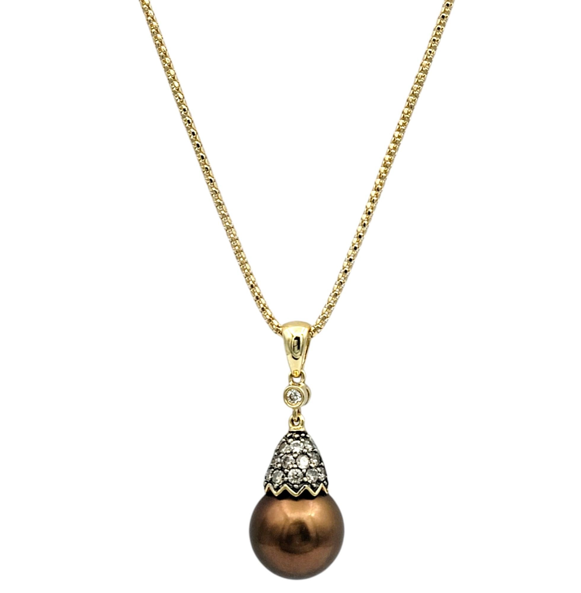 Elevate your style with this exquisite pendant necklace, featuring a luxurious chocolate Tahitian pearl as its centerpiece. This rare pearl, with its rich, earthy hues and luminous sheen, evokes the beauty of nature and the allure of the exotic.