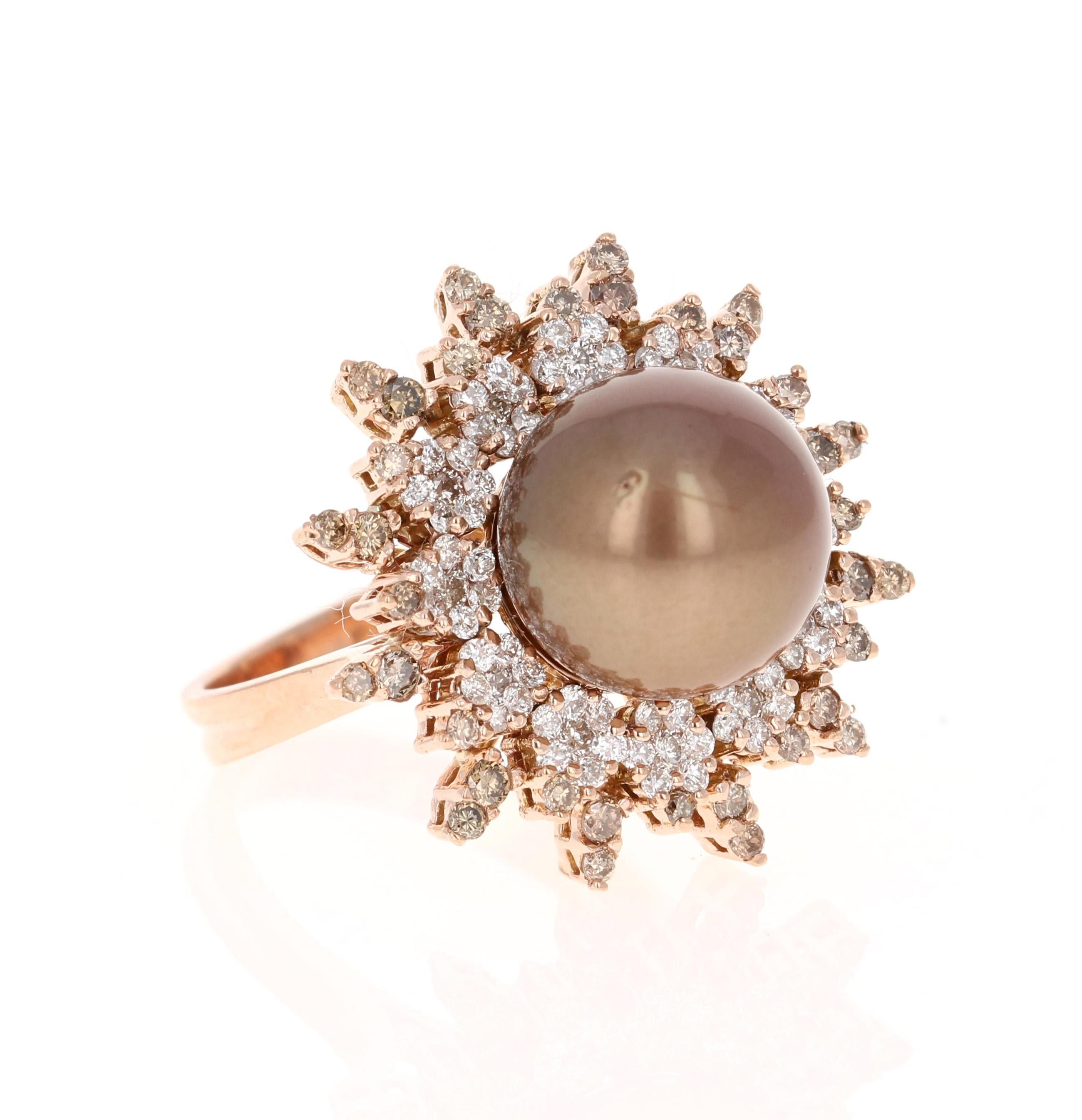 This beautiful Chocolate Tahitian Pearl and Diamond ring has a 11.5 mm Chocolate Pearl and is surrounded by 84  Round Cut Diamonds that weigh 0.80 carats (Clarity: VS, Color: H) and 36 Round Cut Champagne Diamonds that weigh 0.51 carats. The total