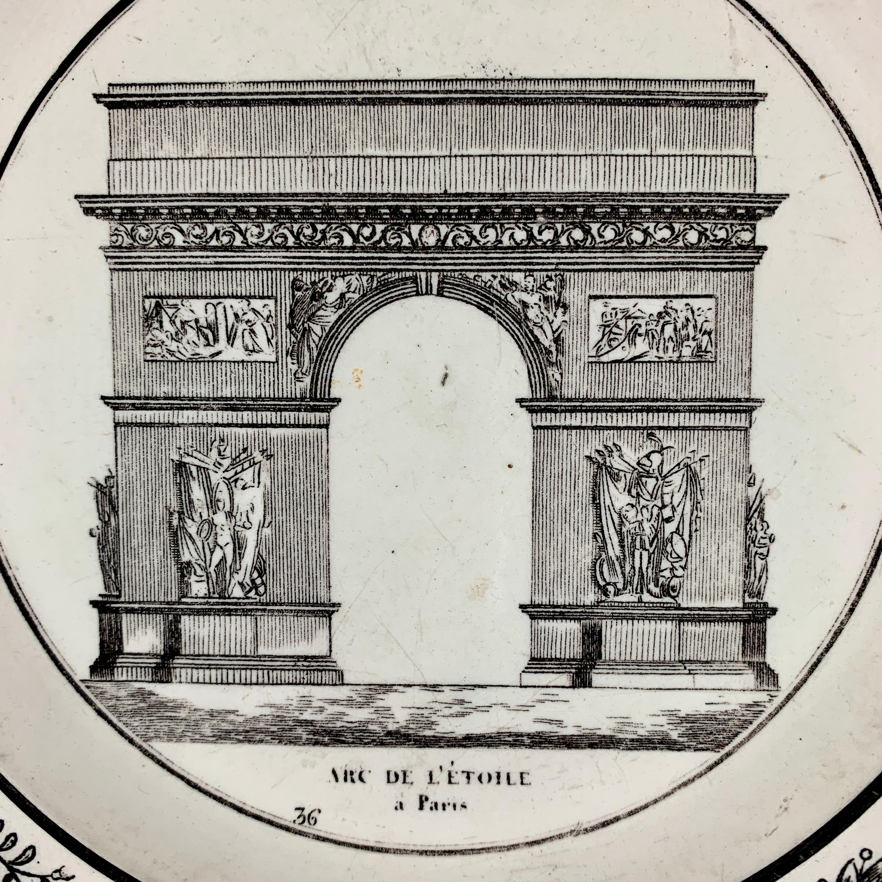 A French neoclassical faïence transfer printed creamware plate produced by P&H Choisy, circa 1824-1836.

A black transfer of an architectural image on a creamware body, depicting the Arc de l’ Étoile à Paris. The Arc is prominent, with the title