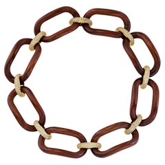 Gargantilla de madera y plata dorada con circonitas de cuatro eslabones - colección NOMAD *