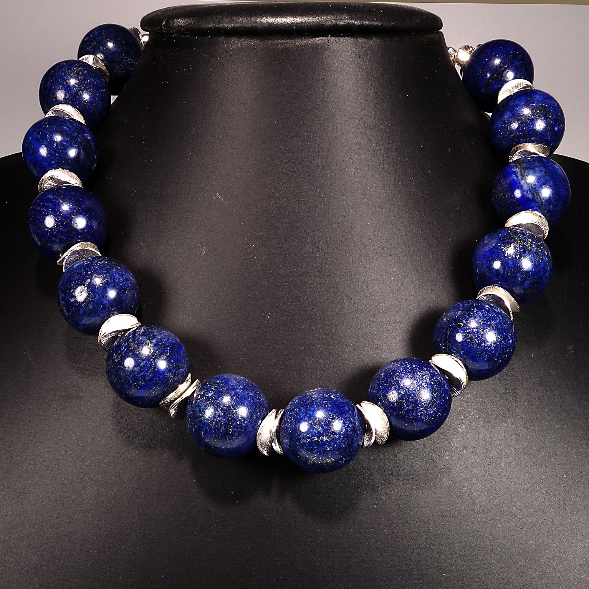Statement choker necklace of 18MM highly polished blue Lapis Lazuli with brushed silver tone flutter accents.  This 15.5 inch choker is secured with a gorgeous Baroque Pearl set in Sterling Silver clasp. This Baroque Pearl can easily be used as a