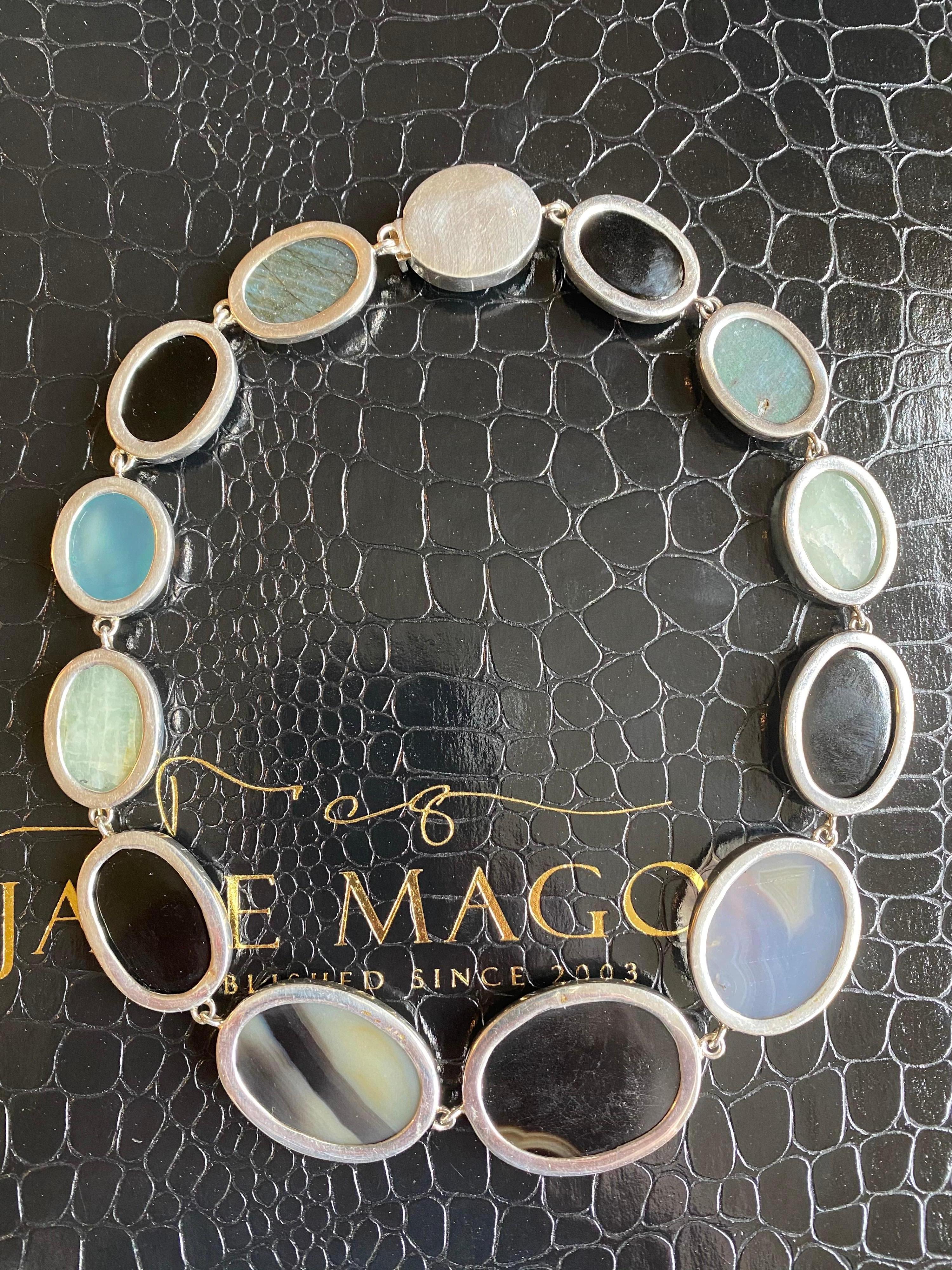 Jane Magon Collections Pebble Gemstone Necklace in Sterling Silver features large Smooth Oval Gemstones of Chalcedony, Black & Gray Agate, and Labradorite. All Bezel Set in a Choker Style Collar Necklace. Sits on the neck elegantly and can be