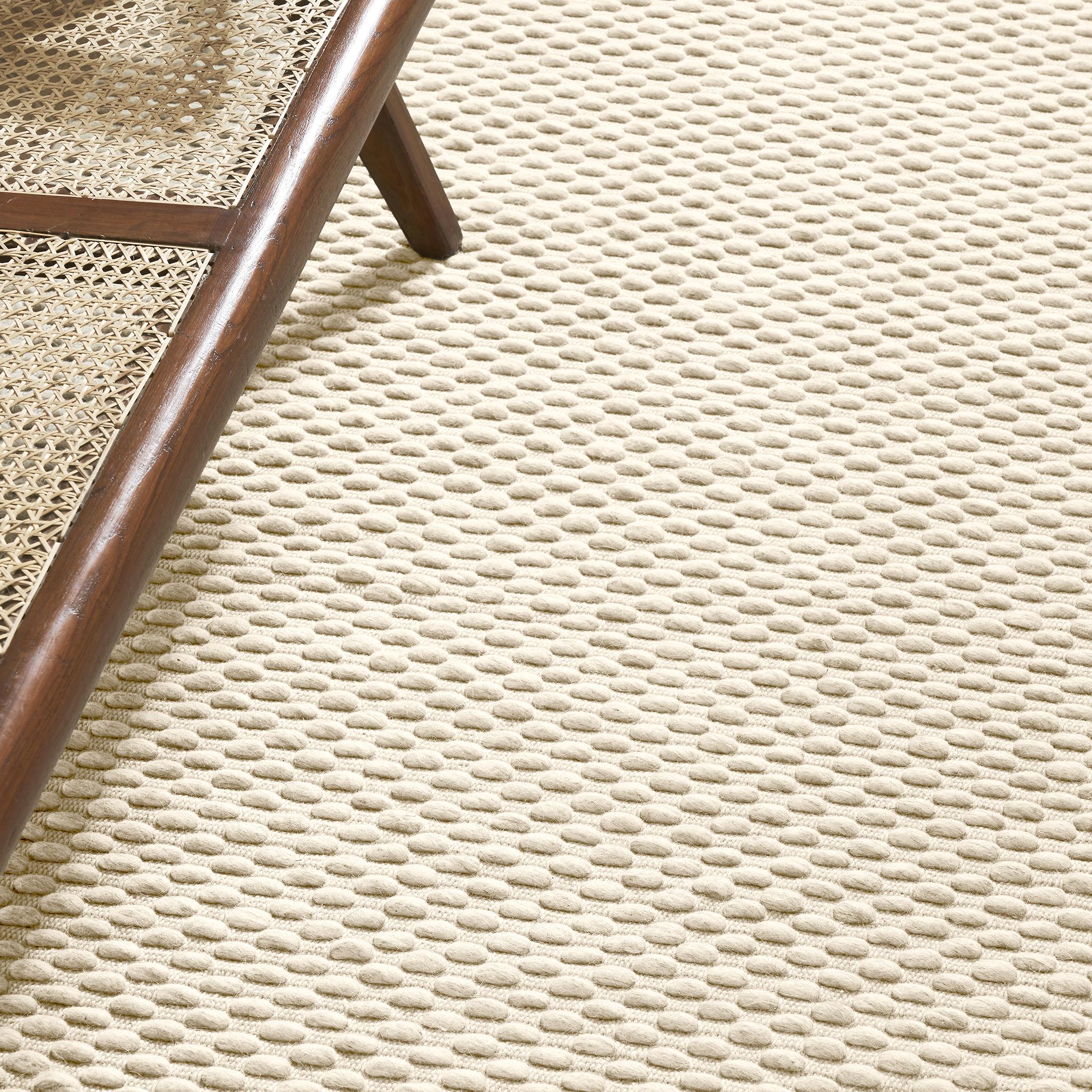 Like a bed of pebbles, Choma's mounds of boiled New Zealand wool are shaped and softened by water. With a foundation of natural cotton woven into the mix, Choma brings, gently underfoot, the depth and stillness of a river bed.

Usage : 
