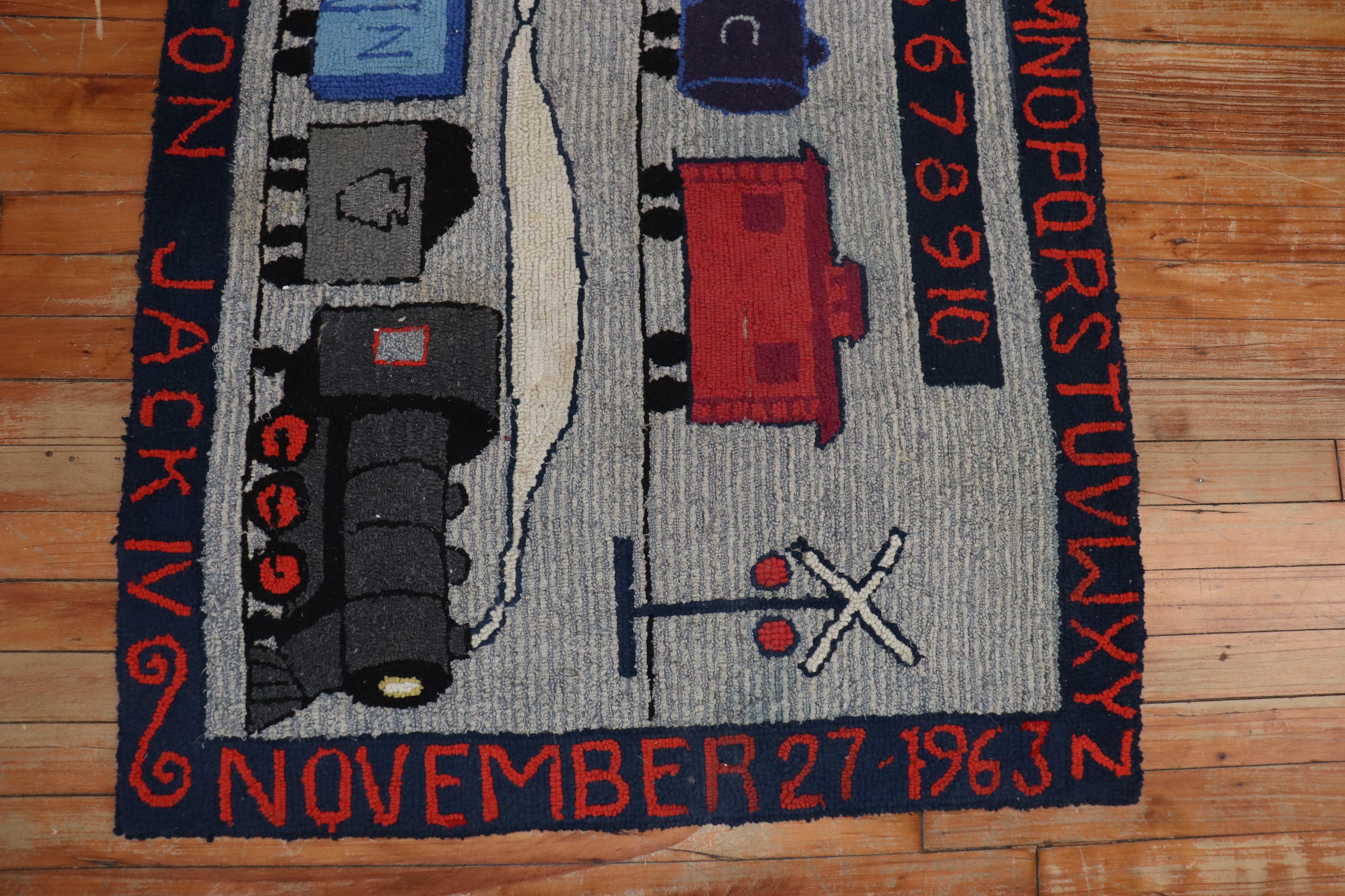 A 20th century pictorial rug with trains on a gray ground. The border has the exact date the rug was completed, the area, the name of the weaver, and the entire alphabet! It’s a conversational piece! So cool!

Measures: 2'10