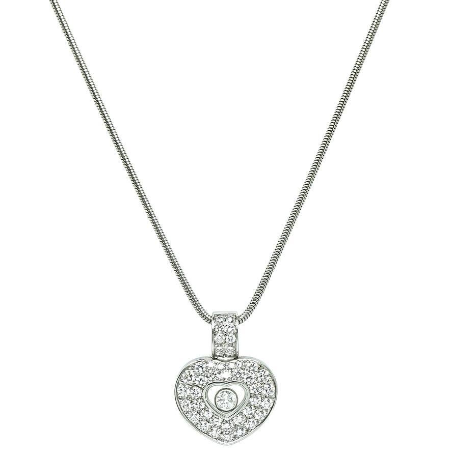 This is an elegant 18k white gold happy diamonds heart pendant necklace by Chopard. The pendant is set with sparkling round cut diamonds that weigh approximately 0.75ct. The color of these diamonds is E-F with VS clarity. The pendant measures 19mm