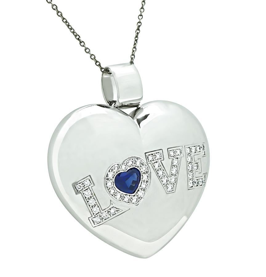 This is an amazing 18k white gold heart pendant by Chopard. The pendant is set with sparkling round cut diamonds that weigh approximately 0.75ct. The color of the diamonds is E with VS clarity. The diamonds are accentuated by heart shape sapphire