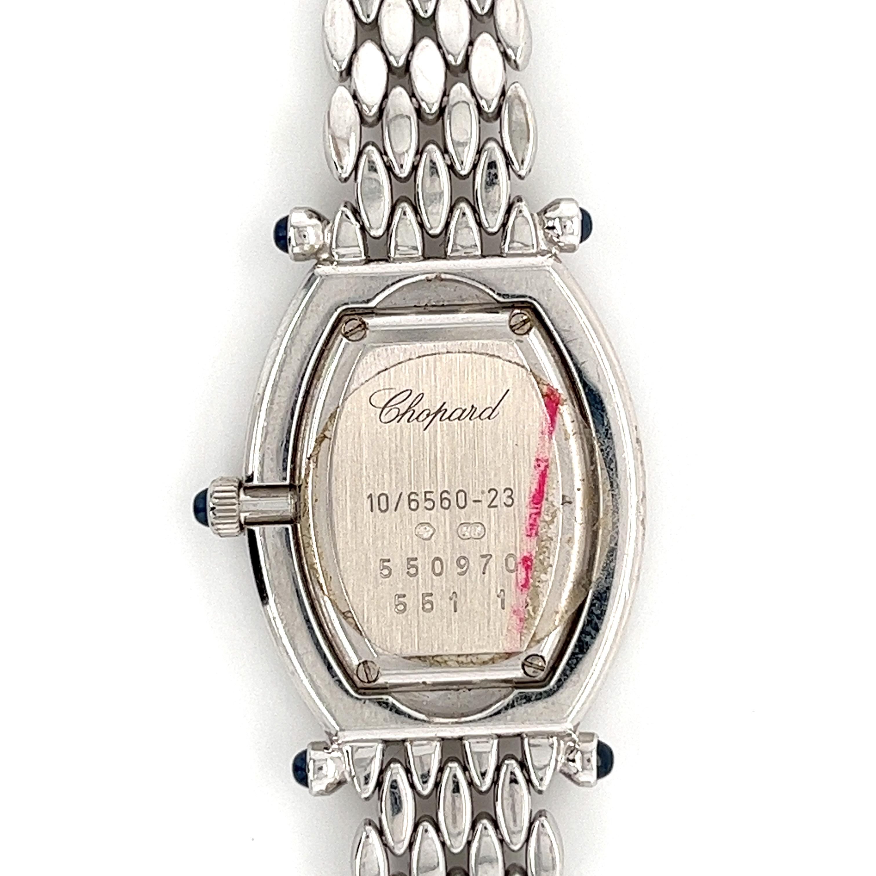 Ladies Chopard Classic 10/6560-23W in 18k white gold with double row pave diamond bezel & case. Quartz movement. Ref 10/6560-23W. This Chopard watch has a Tonneau-shaped, 24mm, case and a white Roman Numeral dial. All of the diamonds are original