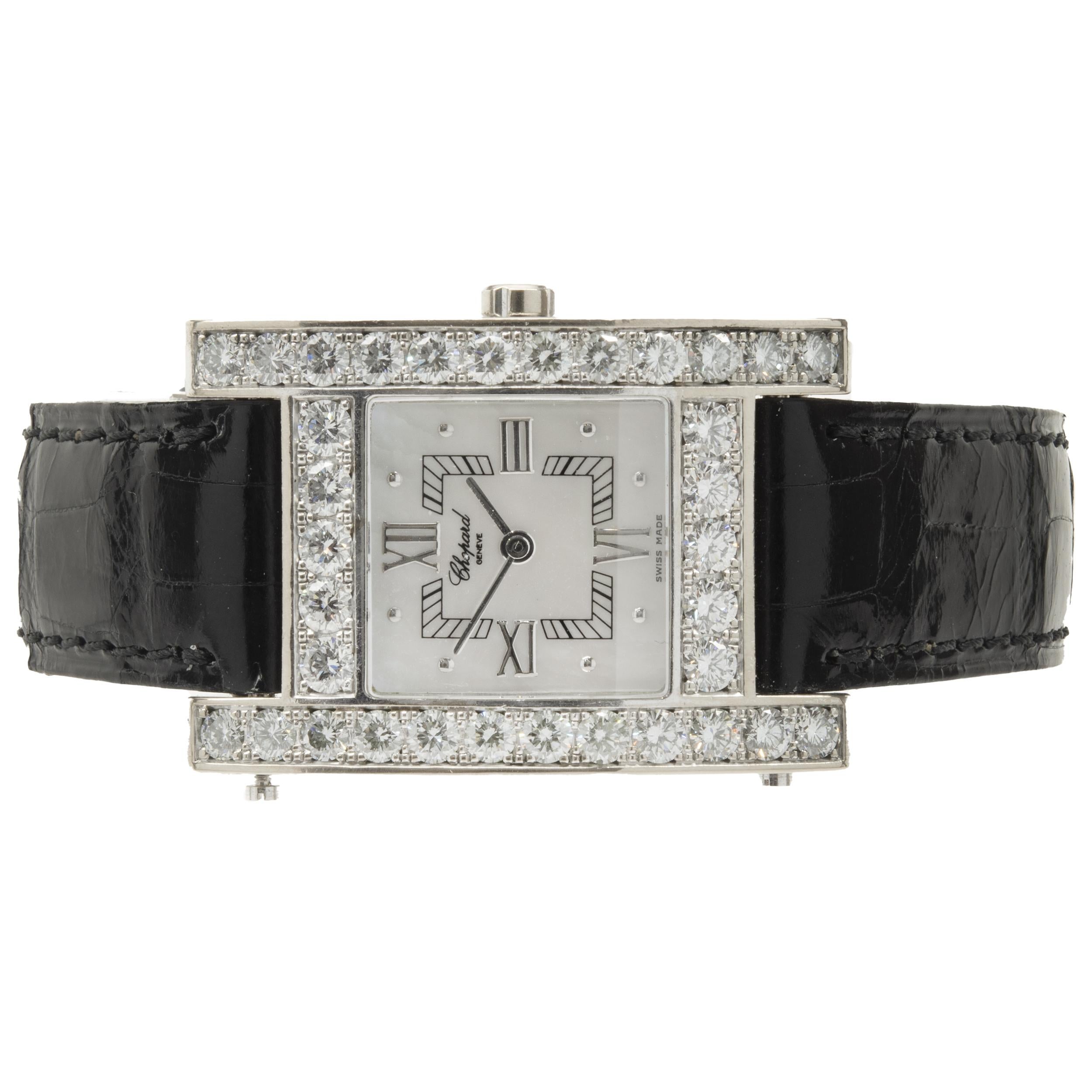 Movement: quartz
Function: hours, minutes
Case: 24x25mm square case, diamond bezel
Band: Chopard black leather strap, buckle
Dial: mother of pearl roman
Reference #: 445/1
Serial: 517XXX

Complete with original box, no papers
Guaranteed to be