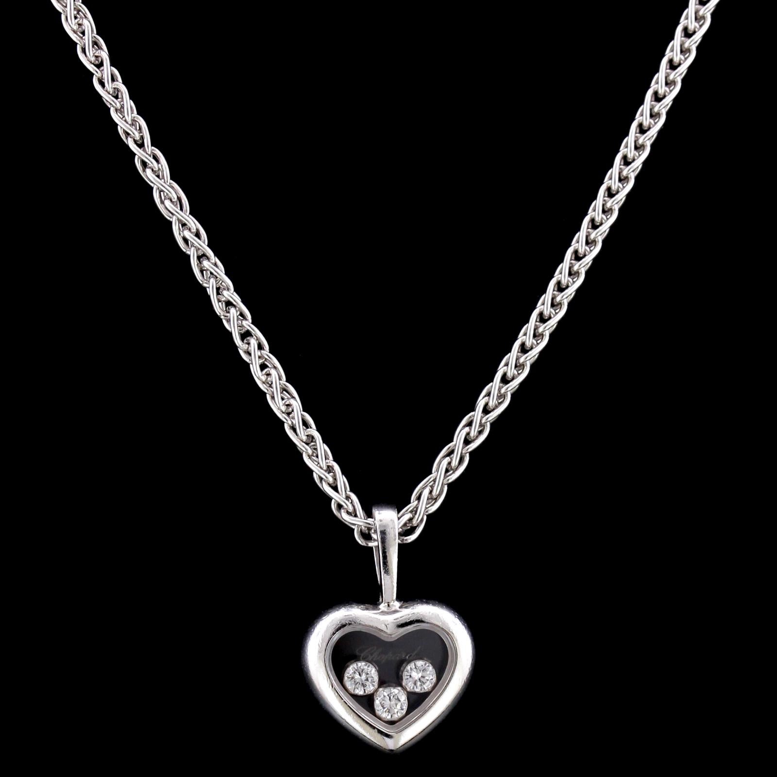 Chopard 18K White Gold Happy Diamond Heart Pendant. The heart encloses three floating diamonds, approx. total wt. .17cts., suspended from a 16