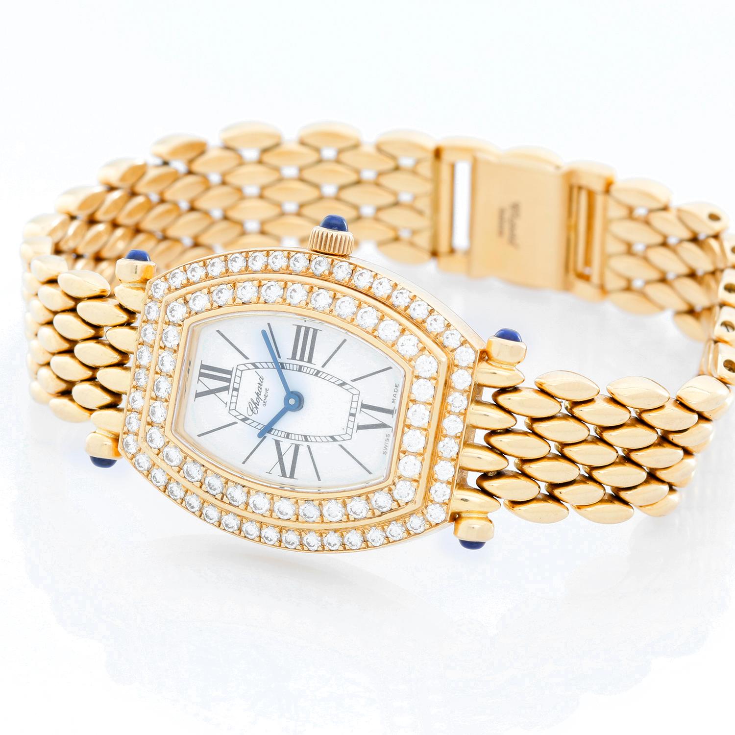 Chopard 18K Yellow Gold Diamond Ladies Watch 551 1 - Quartz. 18K Yellow gold with double row diamonds ( 23 x 35 mm ). White dial with Black Roman numerals and stick hour markers. 18K Yellow gold bracelet. Pre-owned with Chopard box and papers. Total