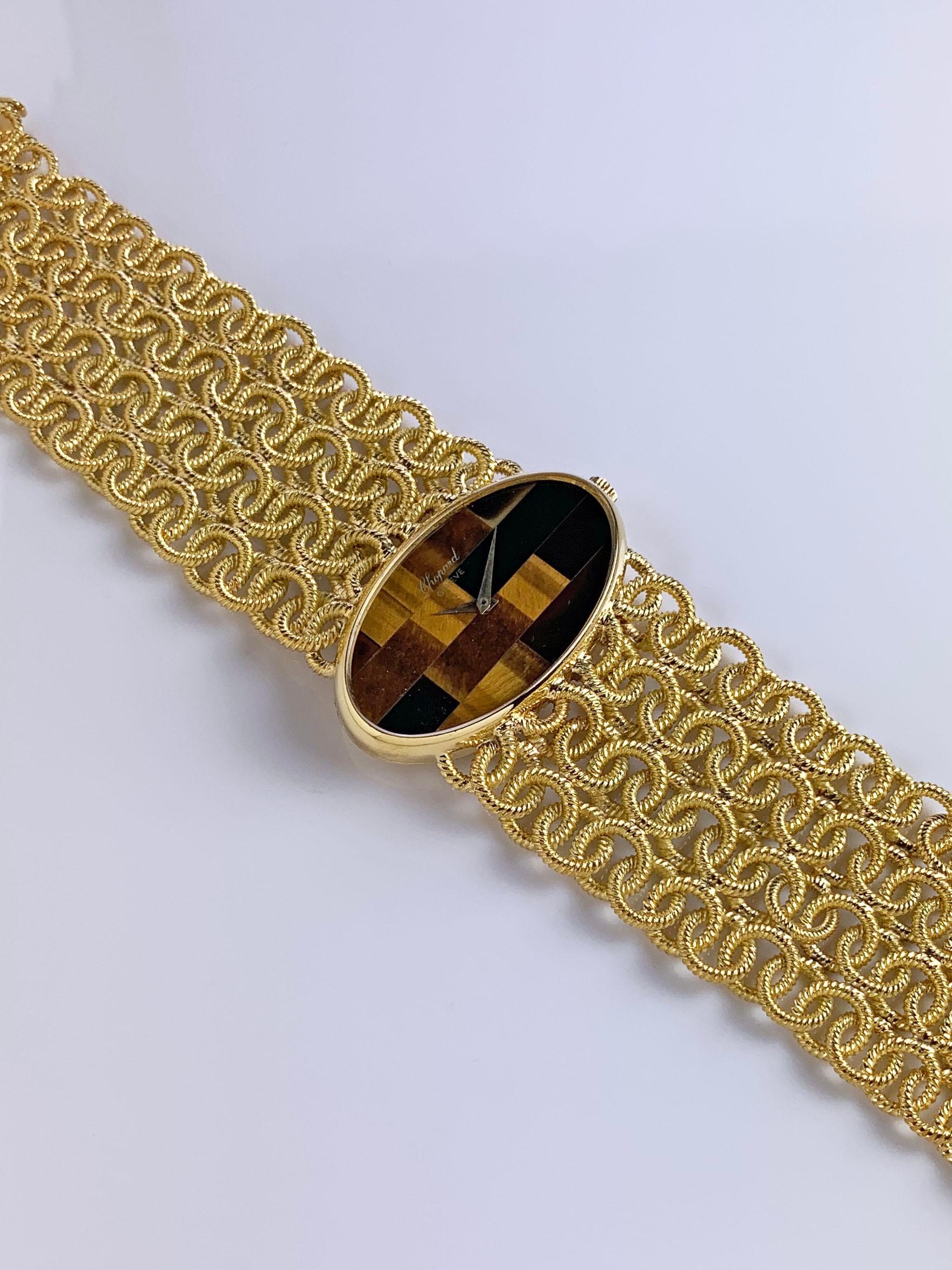 18K Yellow Gold Chopard Tiger's Eye Mosaic Dial Bracelet Watch
Stunning Chopard Tiger's Eye Mosaic Dial 
18K Yellow Gold Oval Case measures 38mm x 22mm
18K Yellow Gold Woven Bracelet with Four Rows and Graduated Size Tapering to Clasp.
Signed