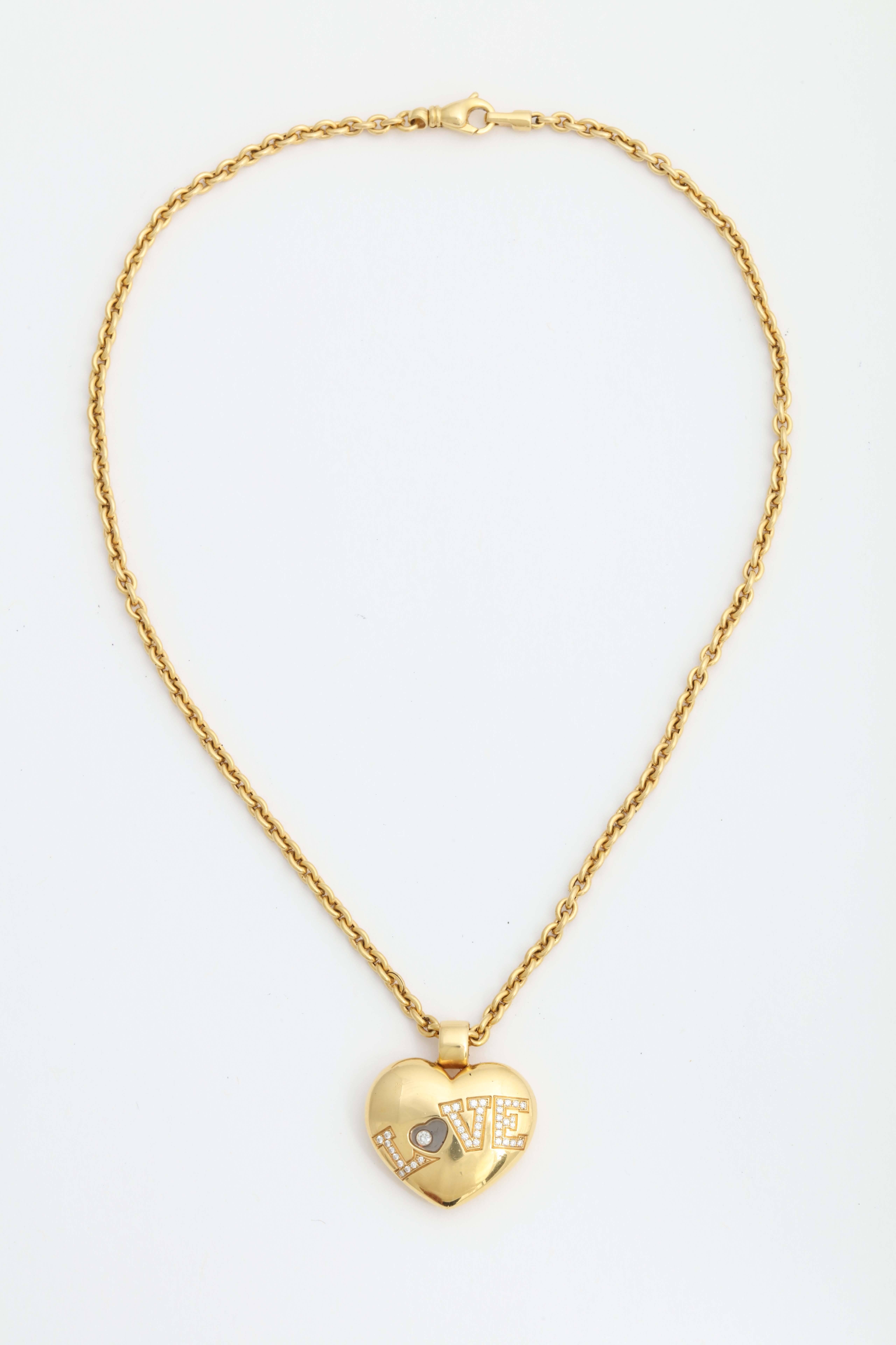 Beautiful Chopard 18k gold “Love” necklace with happy diamonds.

The chain is non-brand, 18k gold.