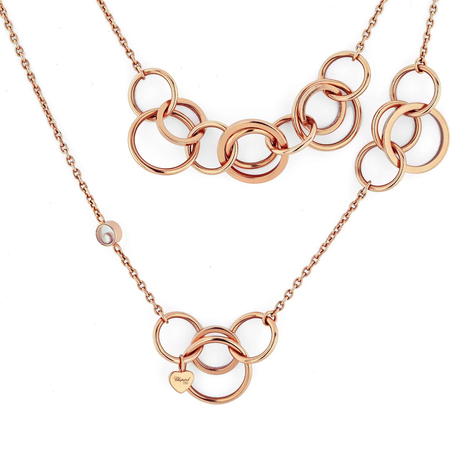Lovely chain by Chopard in 18K Rose gold with stations of Happy Diamonds. Total length 47 inches. 53grams. 