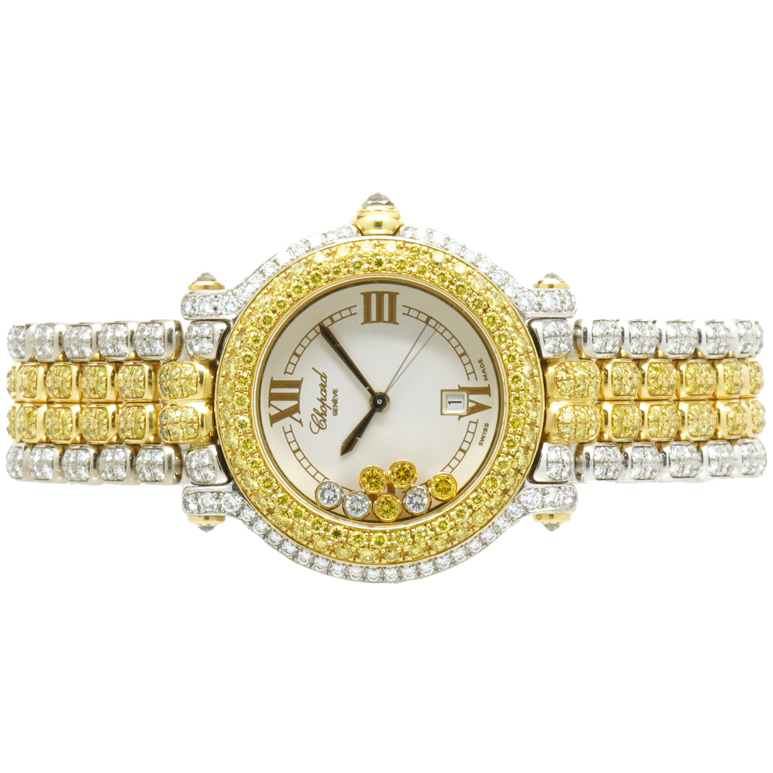 Movement: quartz
Function: hours, minutes, seconds, date 
Case: 33mm round diamond case, push/pull crown, sapphire crystal
Diamonds= 5.27cttw
Color: Yellow
Diamonds= 5.21cttw 
Color: G
Clarity: VS
Band: Two Tone 18k Diamond
Dial: white with