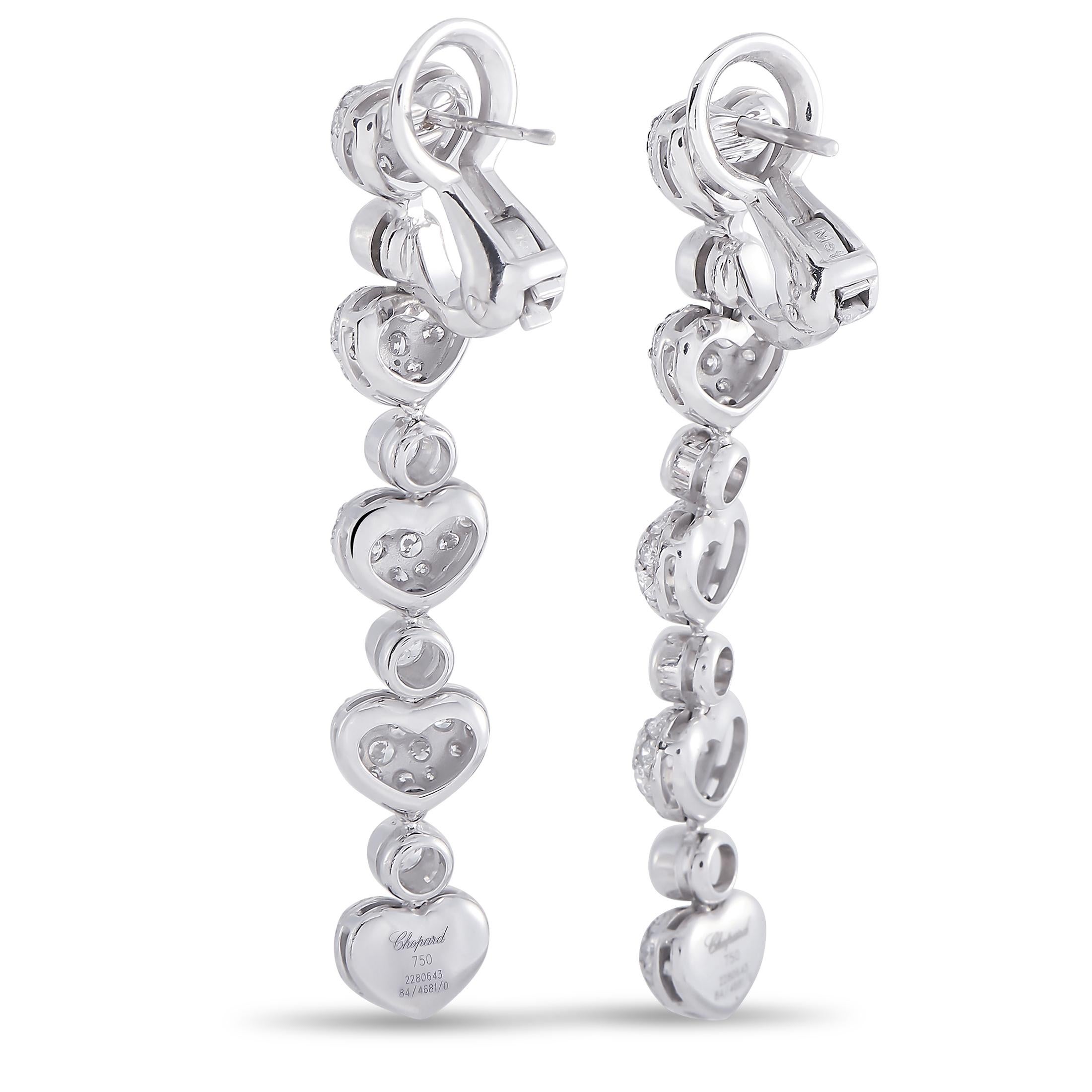 These Chopard earrings with heart motifs are crafted from 18K white gold and each of the two weighs 7.4 grams. They measure 2” in length and 0.37” in width. The pair is set with diamonds that boast E color and VVS clarity and total 3.70 carats.

The