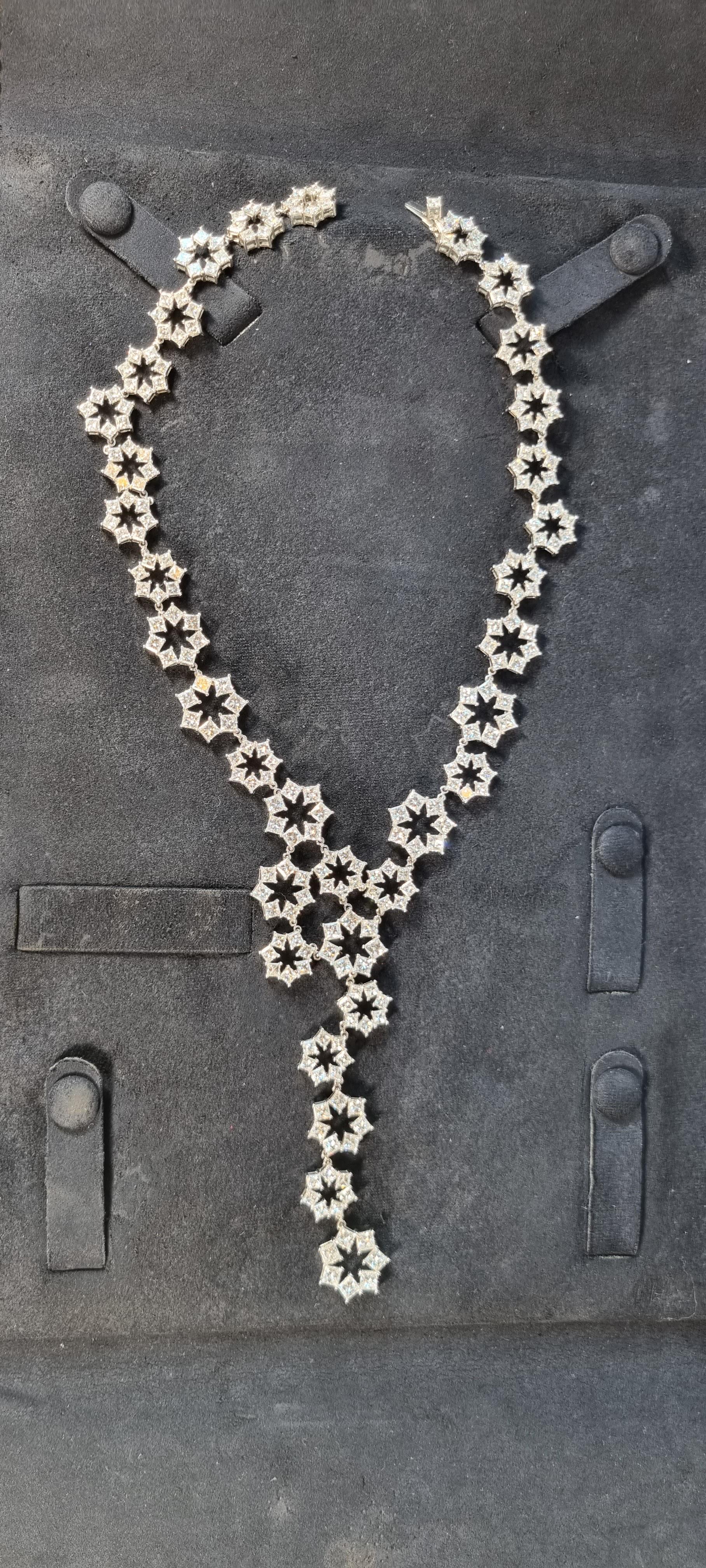 This mesmerizing diamond necklace from Chopard's is crafted in 18 karat white gold, featuring 239 princess cut diamonds that go from 0.15ct to 0.30ct and total diamond weight is 46,59carats, F color, VS clarity. Total gold of necklace 53gr 
With a