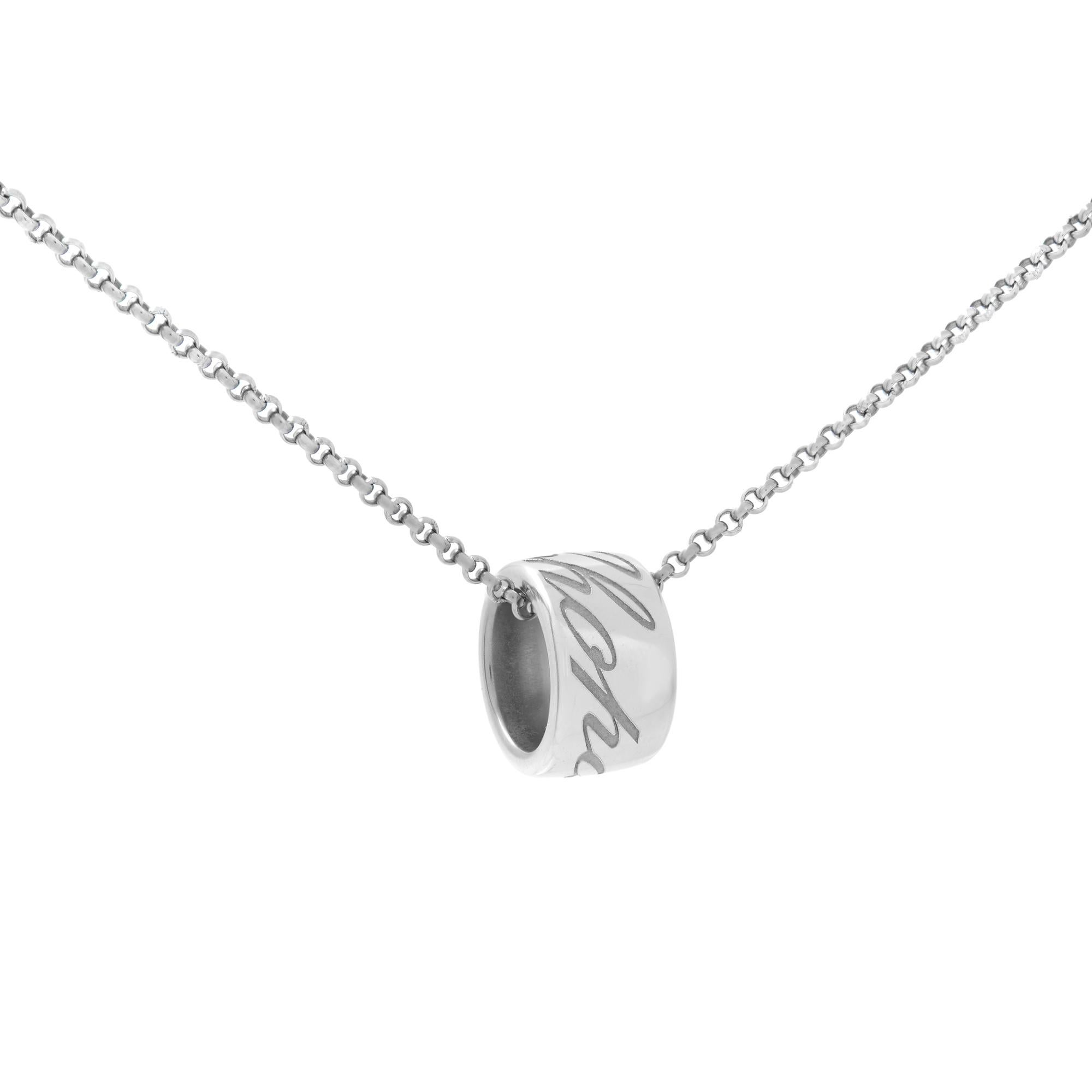 This necklace is crafted of 18k white gold and features a wide 18k white gold slide pendant engraved with the Chopard logo in elegant script. Pendant: 12 mm. Chain: 16.5 inches. Great pre-owned condition. Original box and papers are not included. 