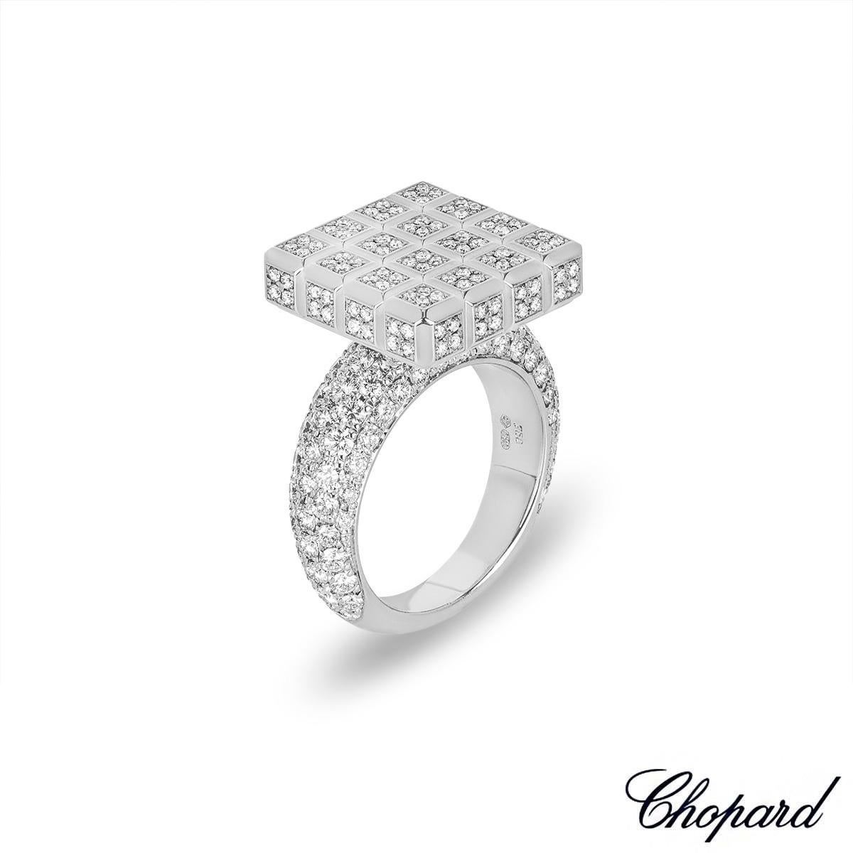 An exquisite 18k white gold diamond set ring from the Chopard Ice Cube collection. The ring is composed of 1.5cm X 1.5cm iconic square ice cube motif, fully pave set with round brilliant cut diamonds, set to a 4mm half eternity pave set diamond
