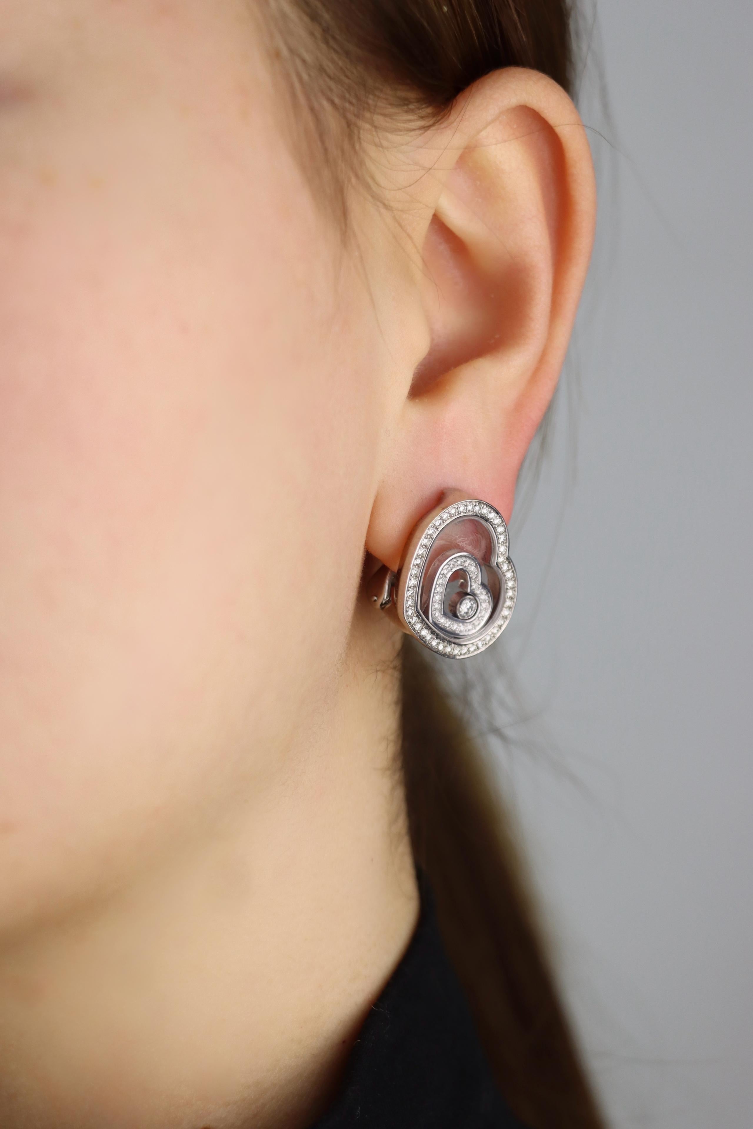 Chopard 18K White Gold Happy Spirit Heart Earrings

Marked:
Chopard
750
HAPPY SPIRIT

Approximate Dimensions:
2.2 cm (Length) 
1.8 cm (Width)
26.4 grams in weight.