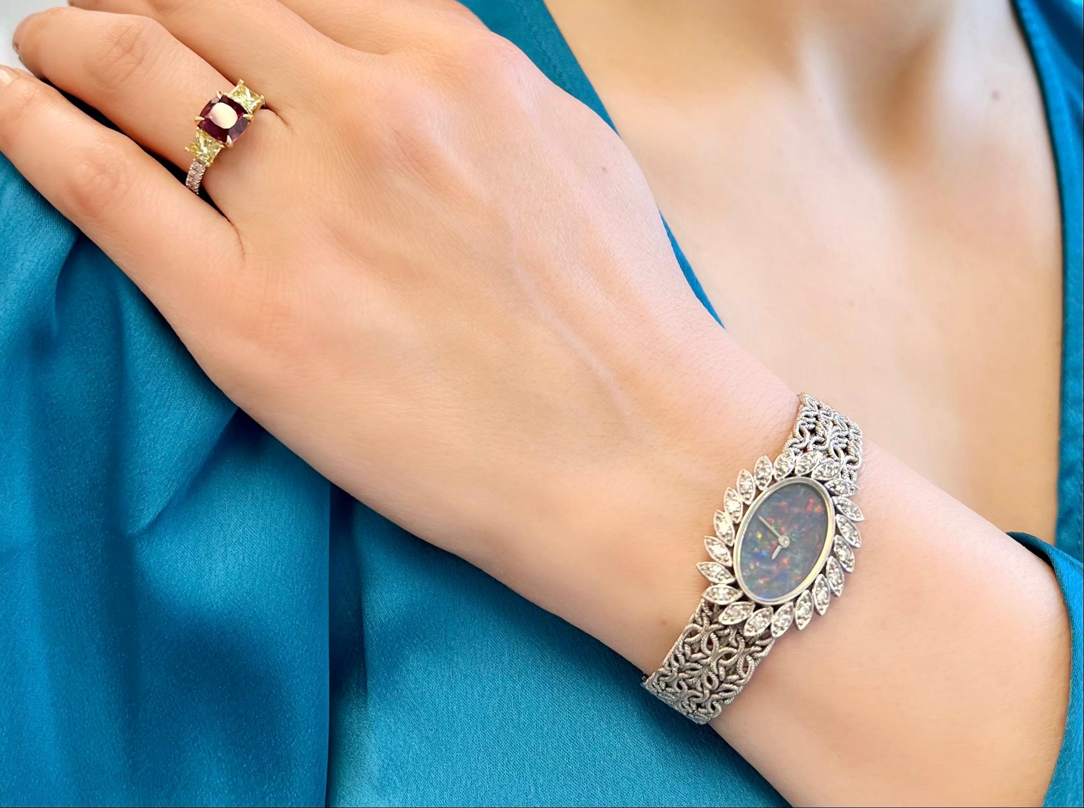 This unique vintage Chopard ladies wristwatch features an elegant opal dial on a textured gold bracelet, crafted entirely in 18k white gold.

The timeless timepiece is adorned with a diamond surround, enhancing its stunning and sophisticated appeal.