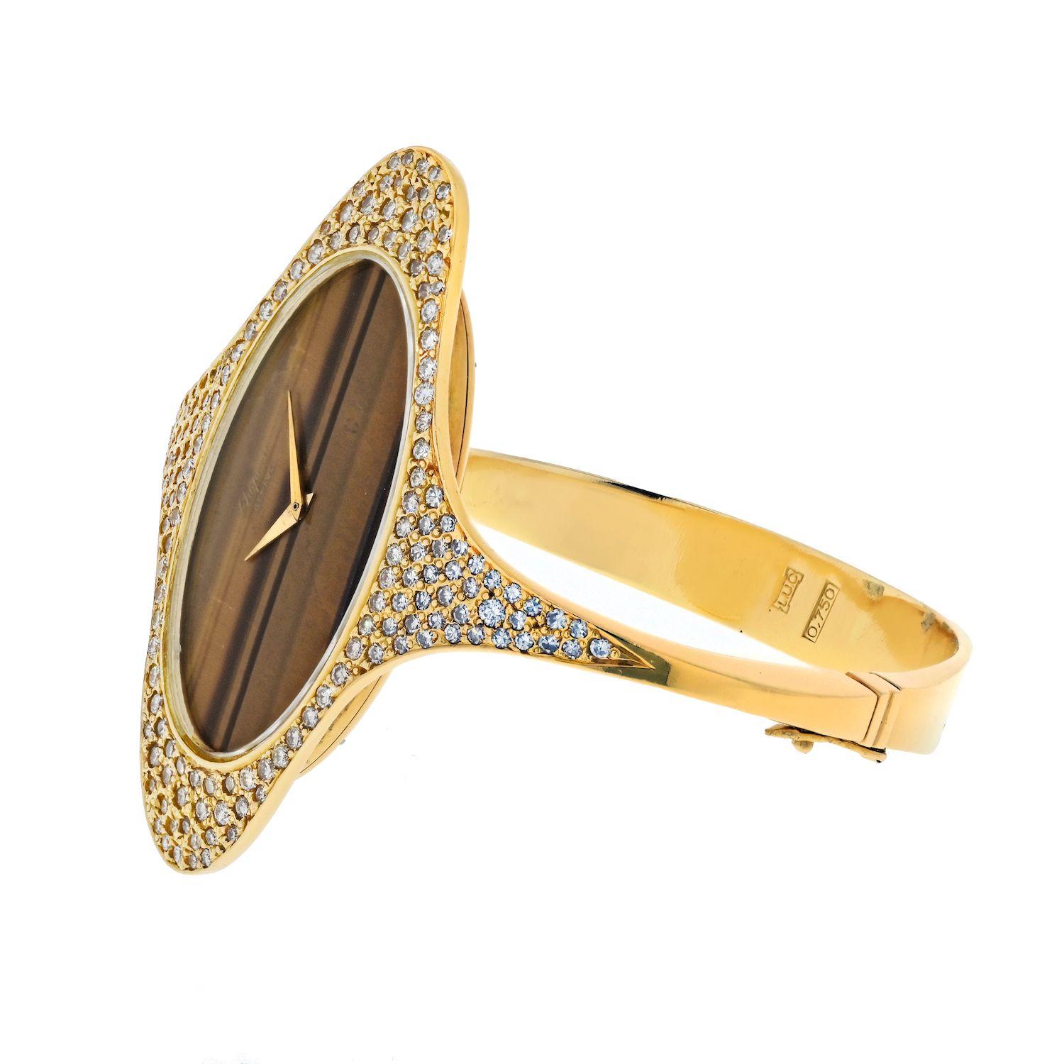 This extraordinary timepiece is designed with an elliptical face crafted from exquisite tiger eye stone, radiating its unique golden-brown allure. 
The manual winding original mechanism within ensures precision and reliability, a testament to