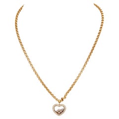 Chopard - Collier en or jaune 18 carats à 5 diamants flottants en forme de coeur