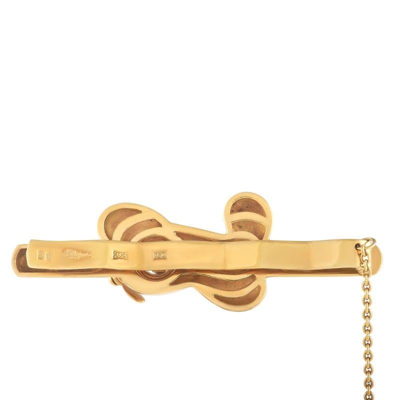 This charming aviation themed Chopard tie bar will instantly add a dash of charm to any suited look. Crafted from opulent 18K Yellow Gold, this piece measures 2 201D; long and 0.5 201D; wide. 
 This jewelry piece is offered in estate condition and