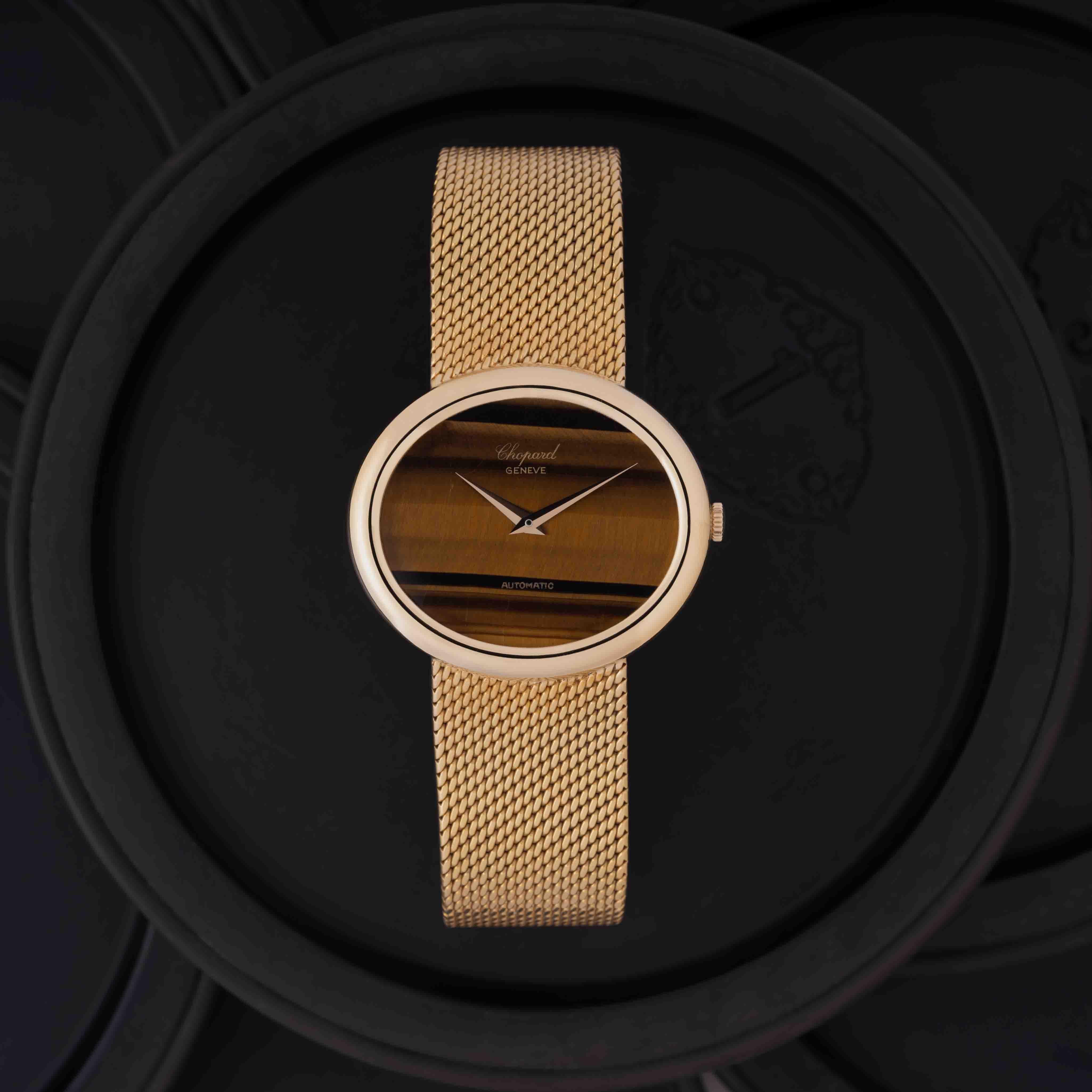 Vintage Chopard 18k Yellow Gold Model 2046 36mm x 32mm Tiger's Eye Dial, Automatic Movement, Rare c.1970s Made in Switzerland c.1970s  111 grams w/ 2025 Chopard Service Card

Maker:  Chopard
Model: 2046
Year: 1970s
Material: 18 Karat yellow Gold and