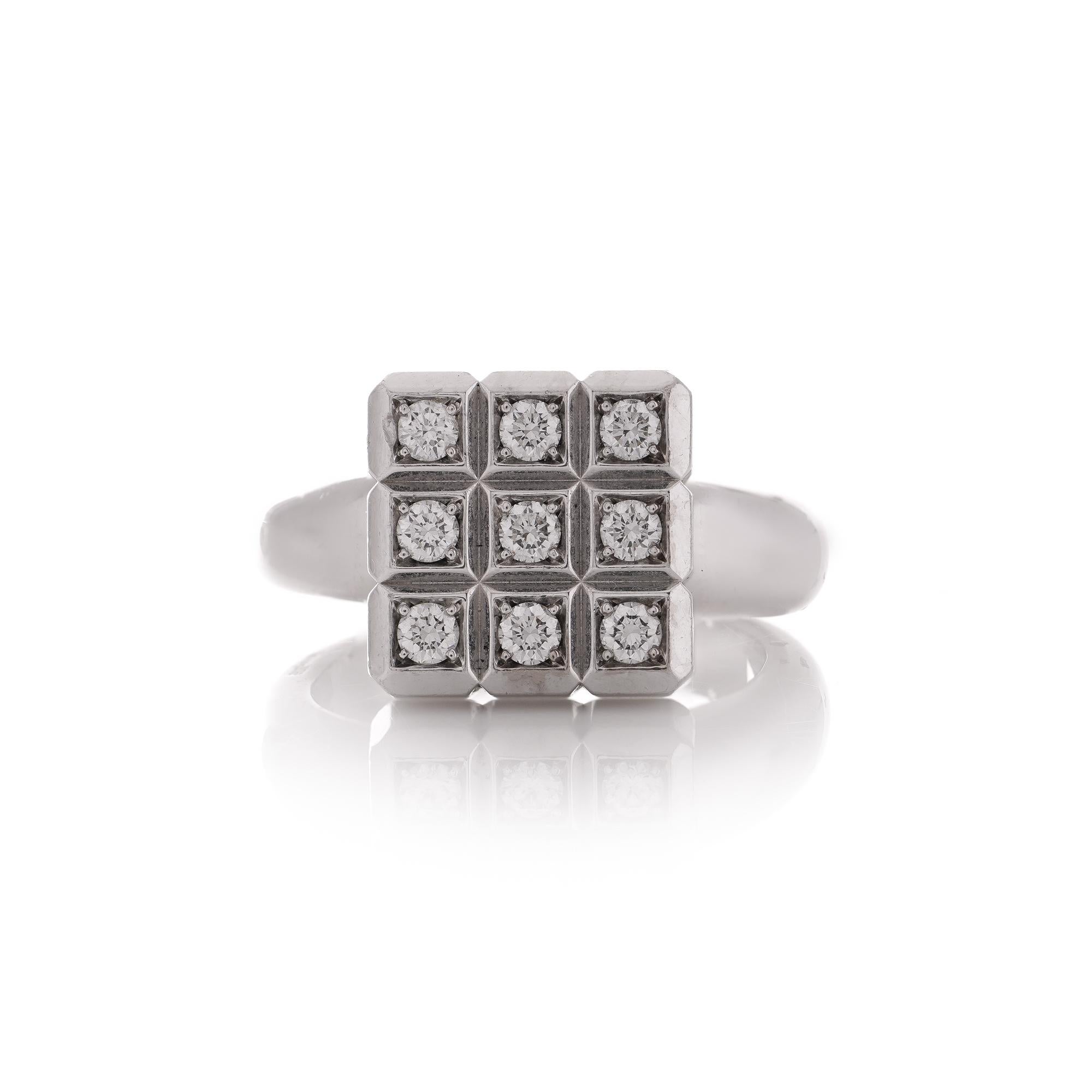 Chopard 18kt white gold ring from the Ice Cube collection features a front adorned with 9 round brilliant diamonds, divided into 9 cubes. Additionally, the front can be twisted and rotated for added versatility.

The ring is hallmarked with 750