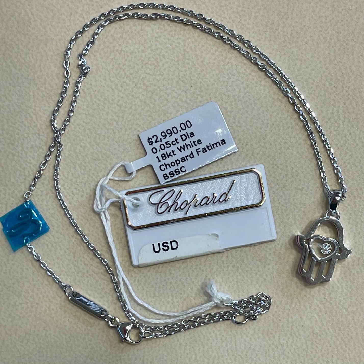 This stunning Good Luck Charms pendant from Chopard features the powerful Hamsa symbol, believed to ward off evil and bring fertility. Crafted in 18Kt. white gold, the pendant showcases a mobile diamond within a heart and is suspended on a 42 cm