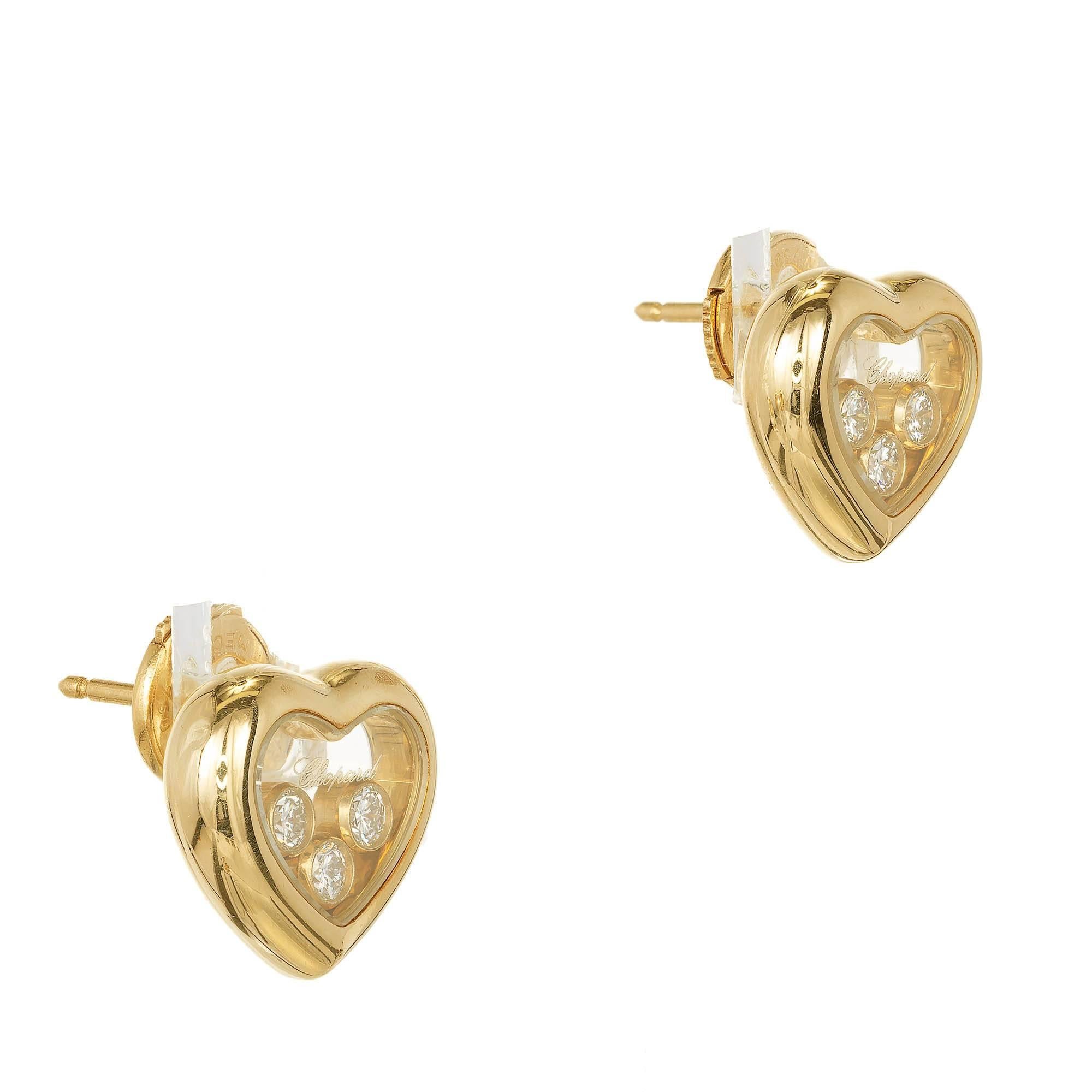 Chopard happy Diamond heart earrings in 18k yellow gold with floating Diamonds. Original earring backs.

6 round full cut Diamonds, approx. total weight .30cts, F, VS
18k yellow gold
Tested: 18k
Stamped: 750
Hallmark: Chopard 922 9554 83/4611-20
6.6