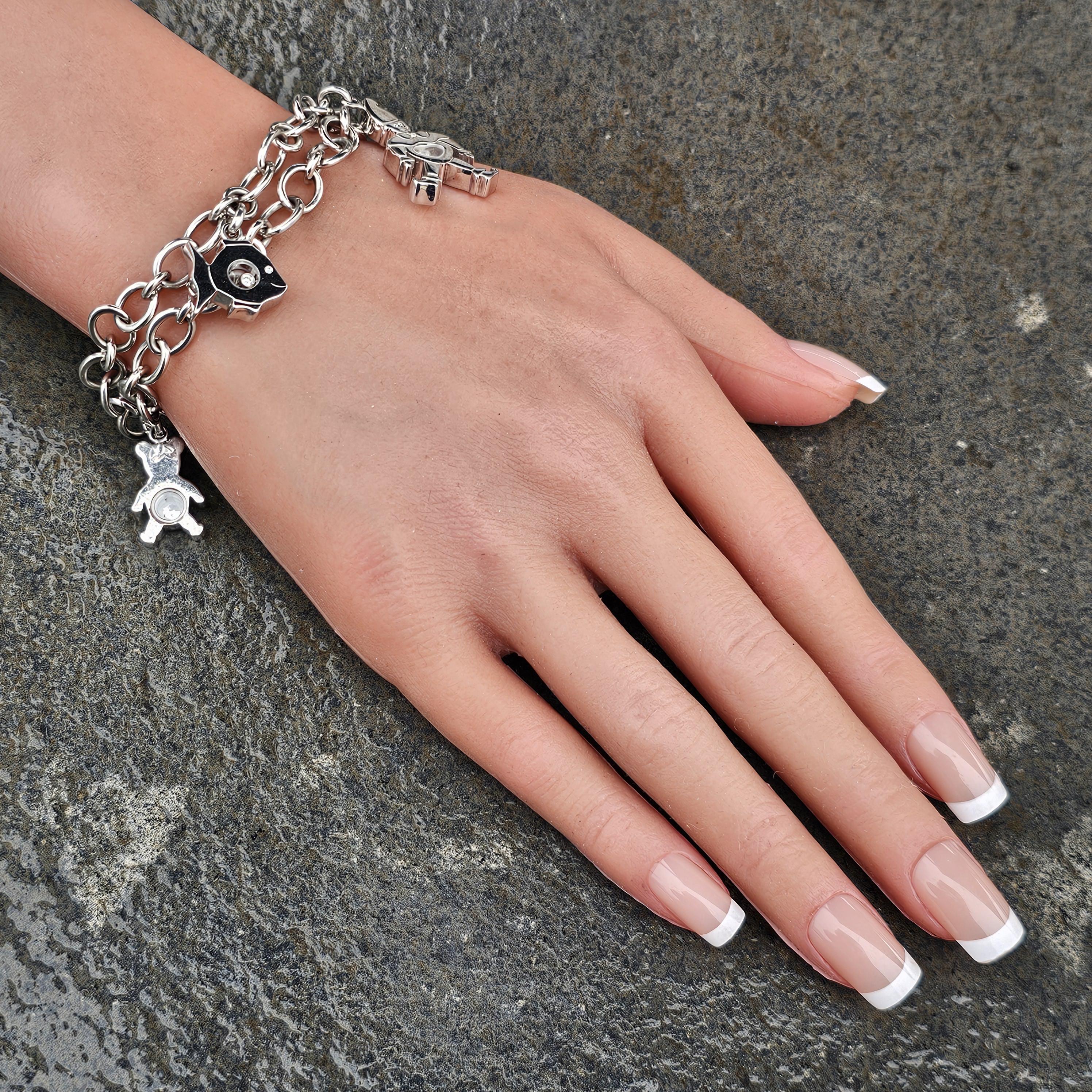 Taille ronde Chopard Bracelet à 4 breloques éléphant clown poisson heureux en or blanc 18 carats en vente