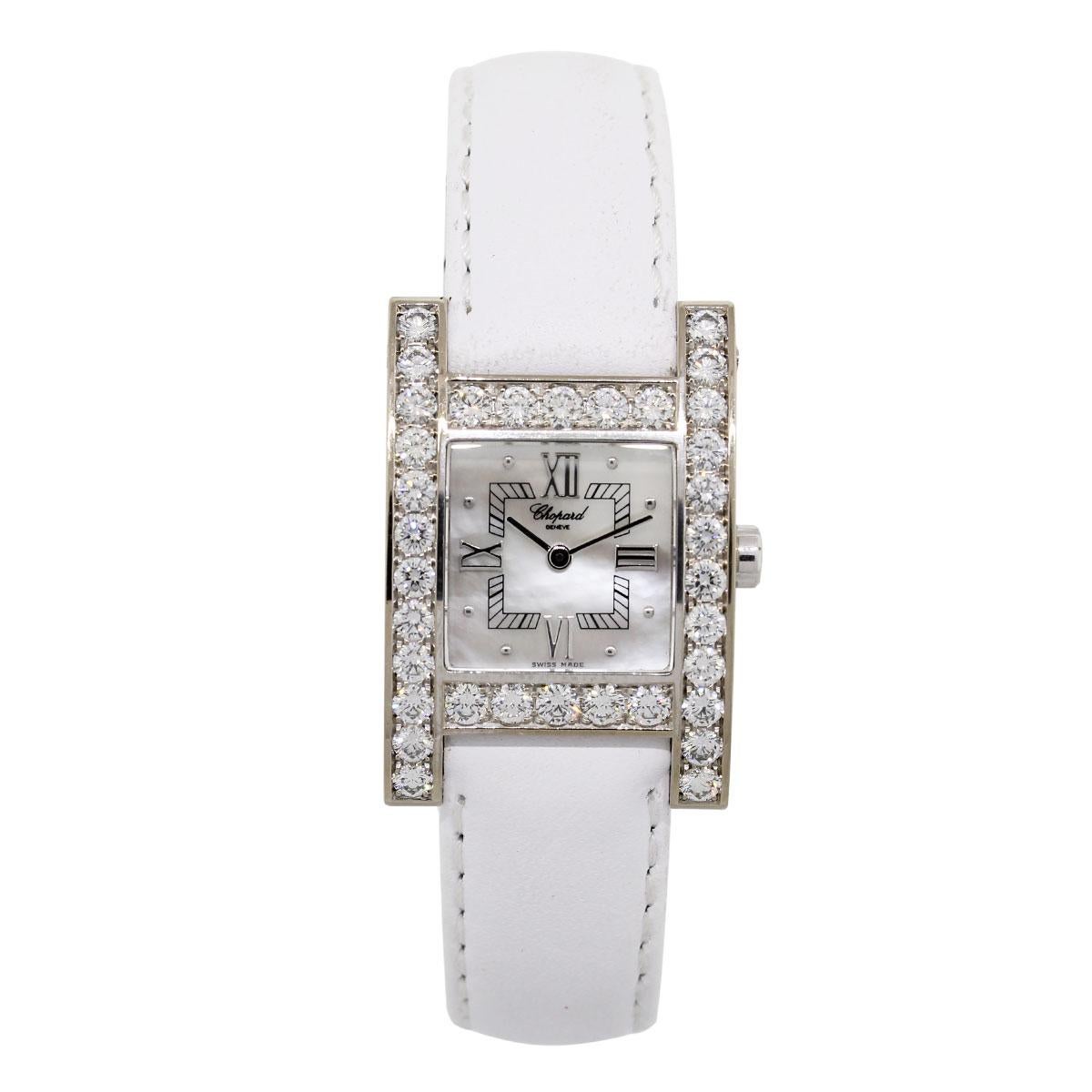 Brand: Chopard
MPN: 445/1
Model: Your Hour
Case Material: 18k white gold
Case Diameter: 24.5mm
Bezel: Diamond bezel
Dial: Mother of pearl roman dial
Bracelet: White leather strap (aftermarket)
Crystal: Sapphire
Size: Will fit up to a 6.75″