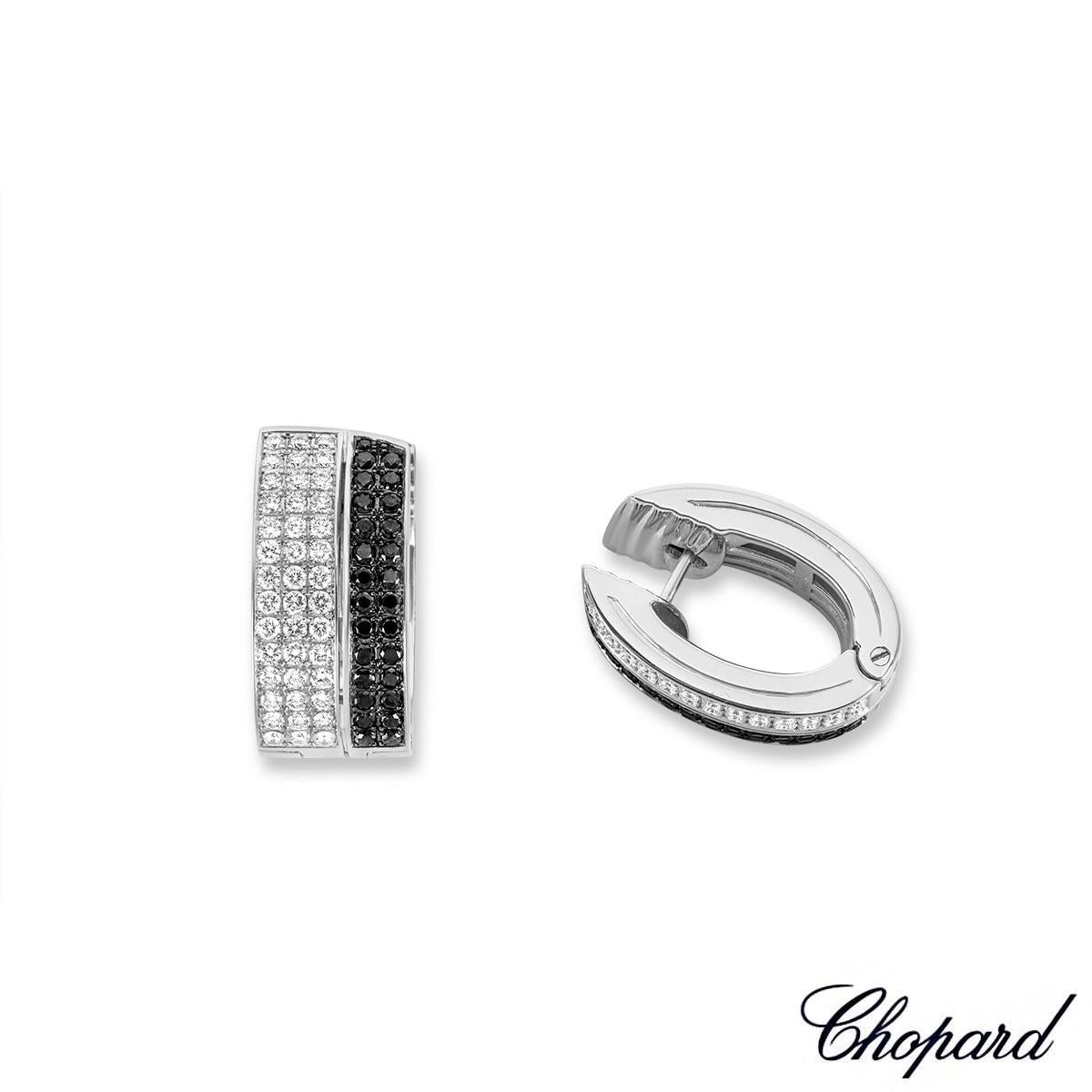 An elegant pair of 18k white gold diamond set oval earrings from Chopard. The earrings are set with a triple row of pave set with clear round brilliant cut diamonds in a horizontal design totalling 1.35ct, F-G colour and VS in clarity, complemented